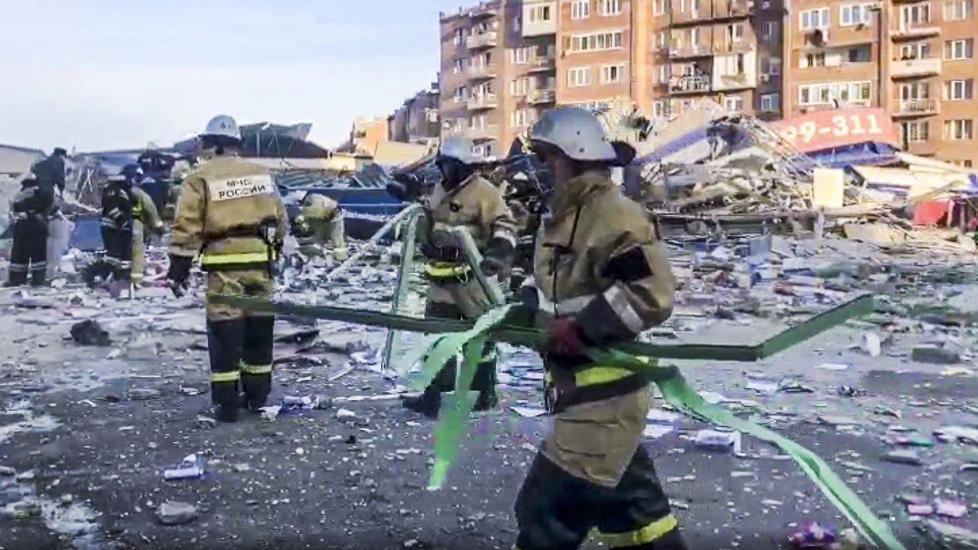 Russian Emergency Ministry employees work at a scene of a powerful explosion in Vladikavkaz, Russia, Friday, Feb. 12, 2021