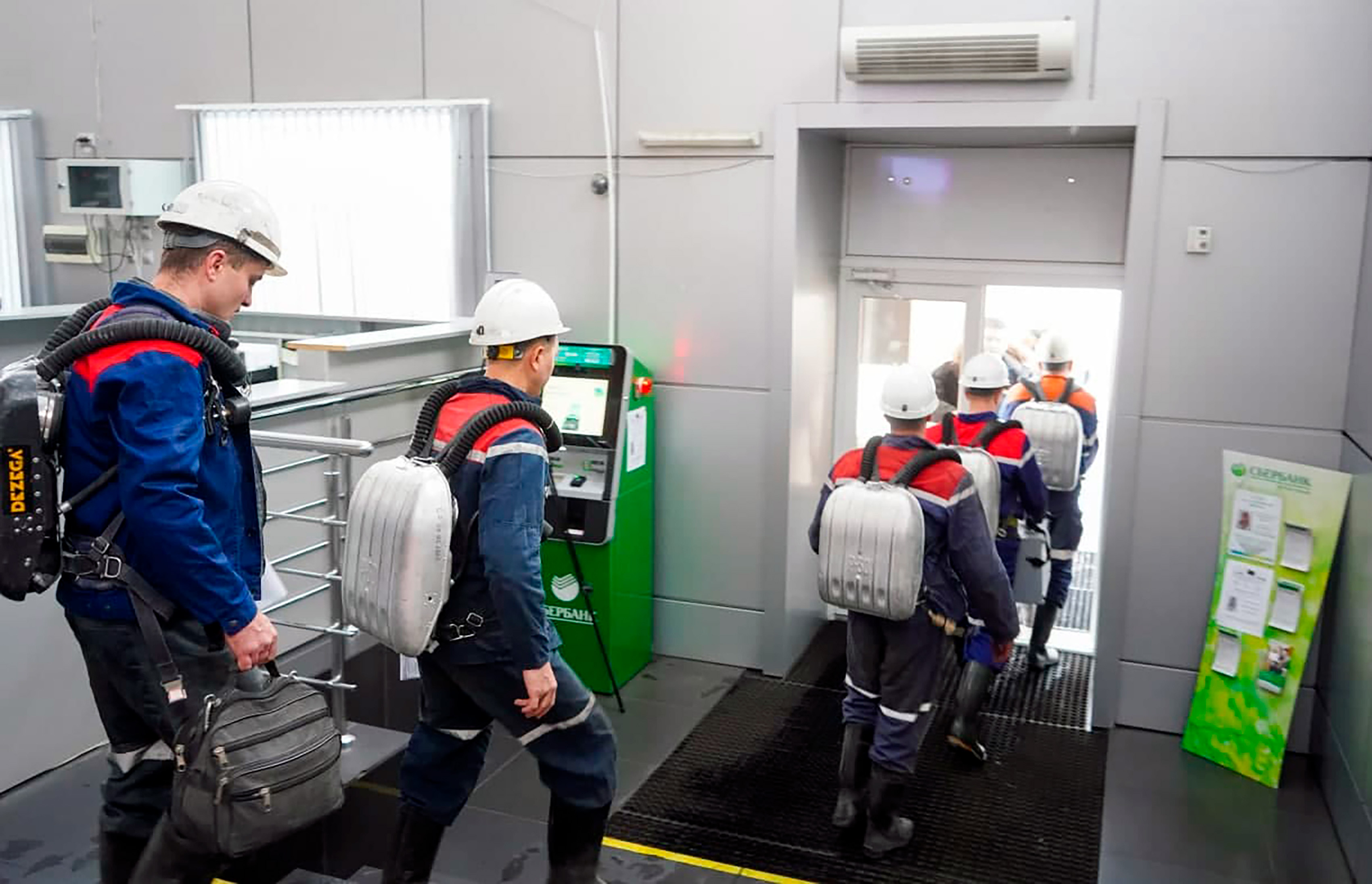 Rescuers walk at the Listvyazhnaya coal mine out of the Siberian city of Kemerovo