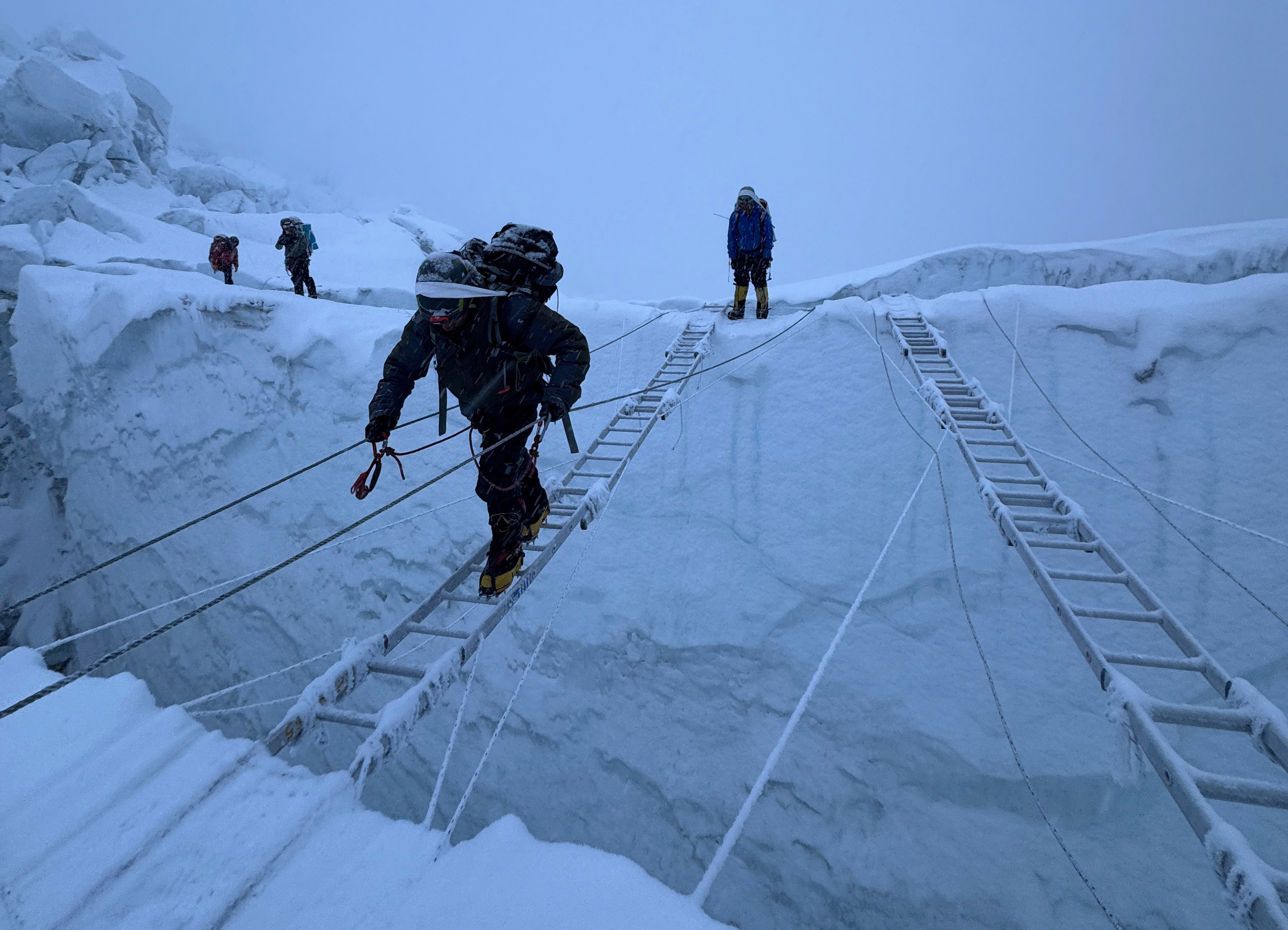 Mountaineers ascend Khumbu Icefall on their way to the summit of Mount Everest, Nepal, Thursday, May 7, 2026. (AP Photo/Pasang Rinzee Sherpa)