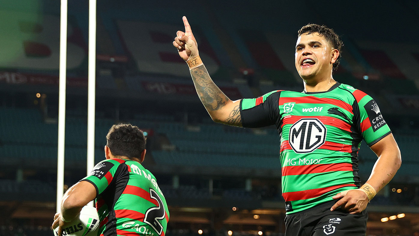 Rabbitohs star Latrell Mitchell celebrates a try against the Cowboys