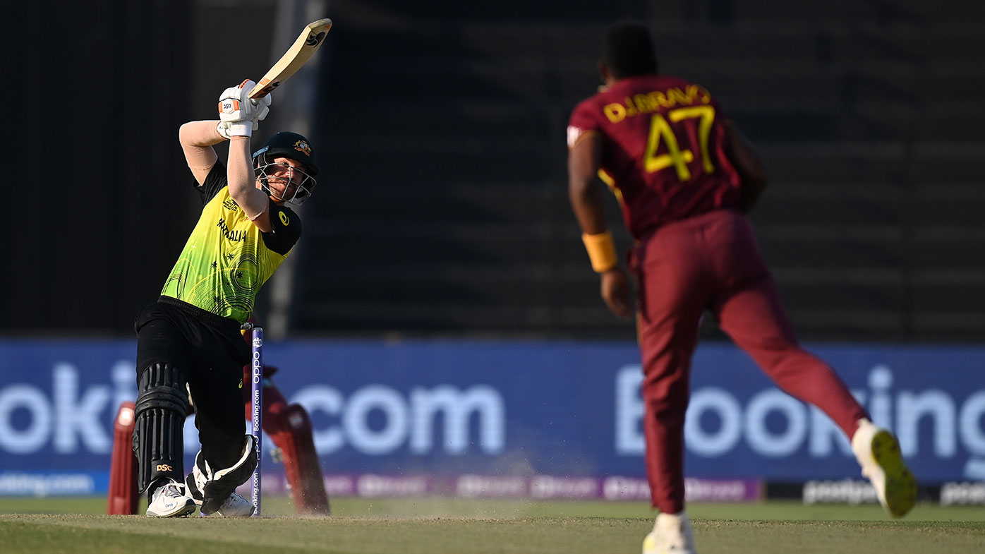  David Warner of Australia plays a shot during the ICC Men's T20 World Cup match between Australia and Windie