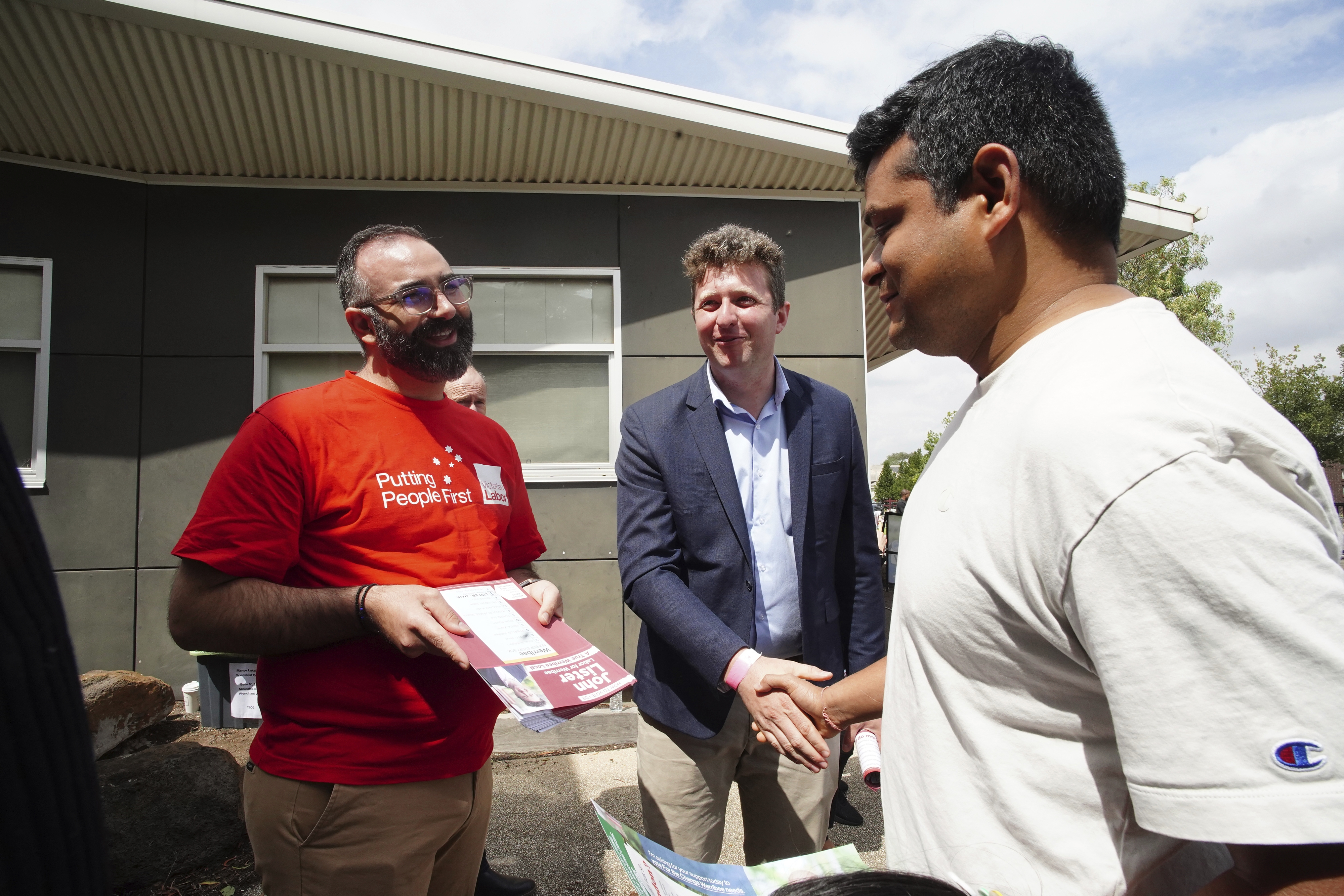 John Lister, Labor Party candidate for Werribee, is seen at Manor Lakes Primary School distributing how-to-vote cards in Wyndham Vale on Saturday, 8 February 2025. Photo THE AGE/ LUIS ENRIQUE ASCUI