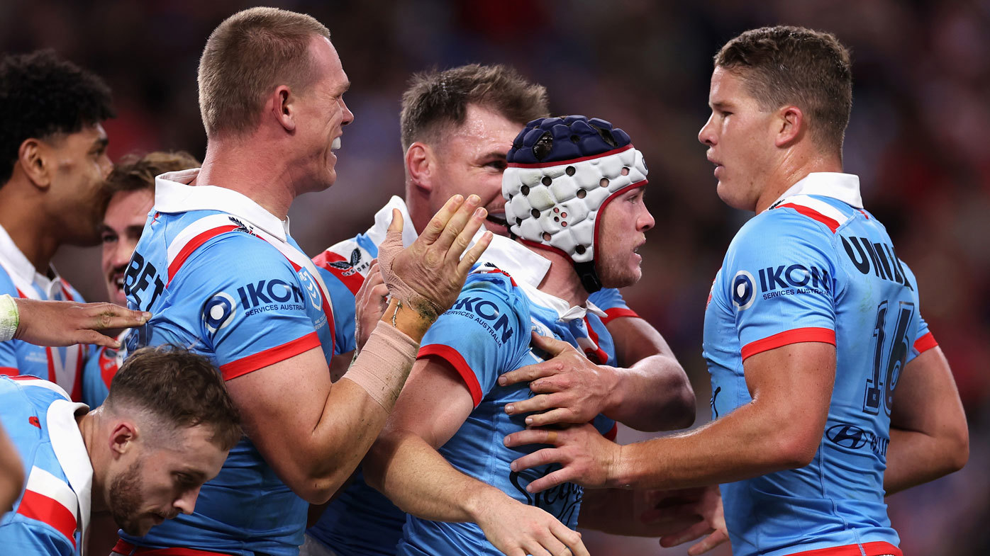 The Roosters celebrate a try in their big Anzac Day win over the Dragons.