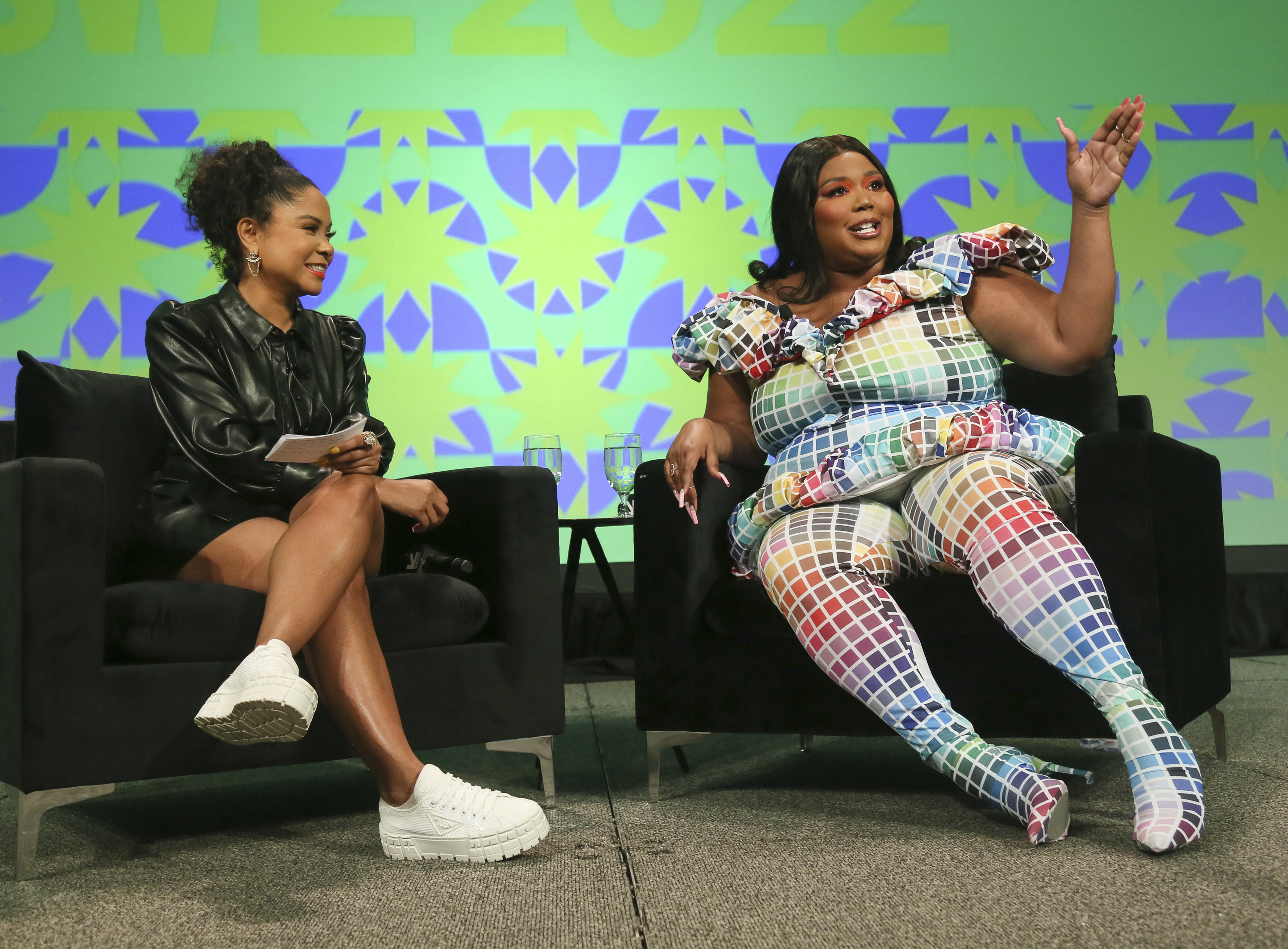 Lizzo, right, and iHeart Media's Angela Yee take part in a keynote speech at the Austin Convention Center during the South by Southwest Music Festival on Sunday, March 13, 2022, in Austin, Texas.