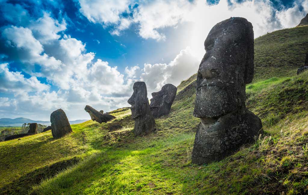 The famous Moai statues stand at Rano Raraku on Easter Island, Chile. Their stone bodies are buried underneath the ground.