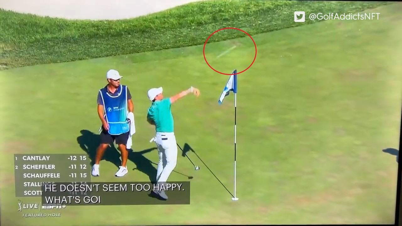 Rory McIlroy hurls a fan's remote control golf ball into a lake out of anger.
