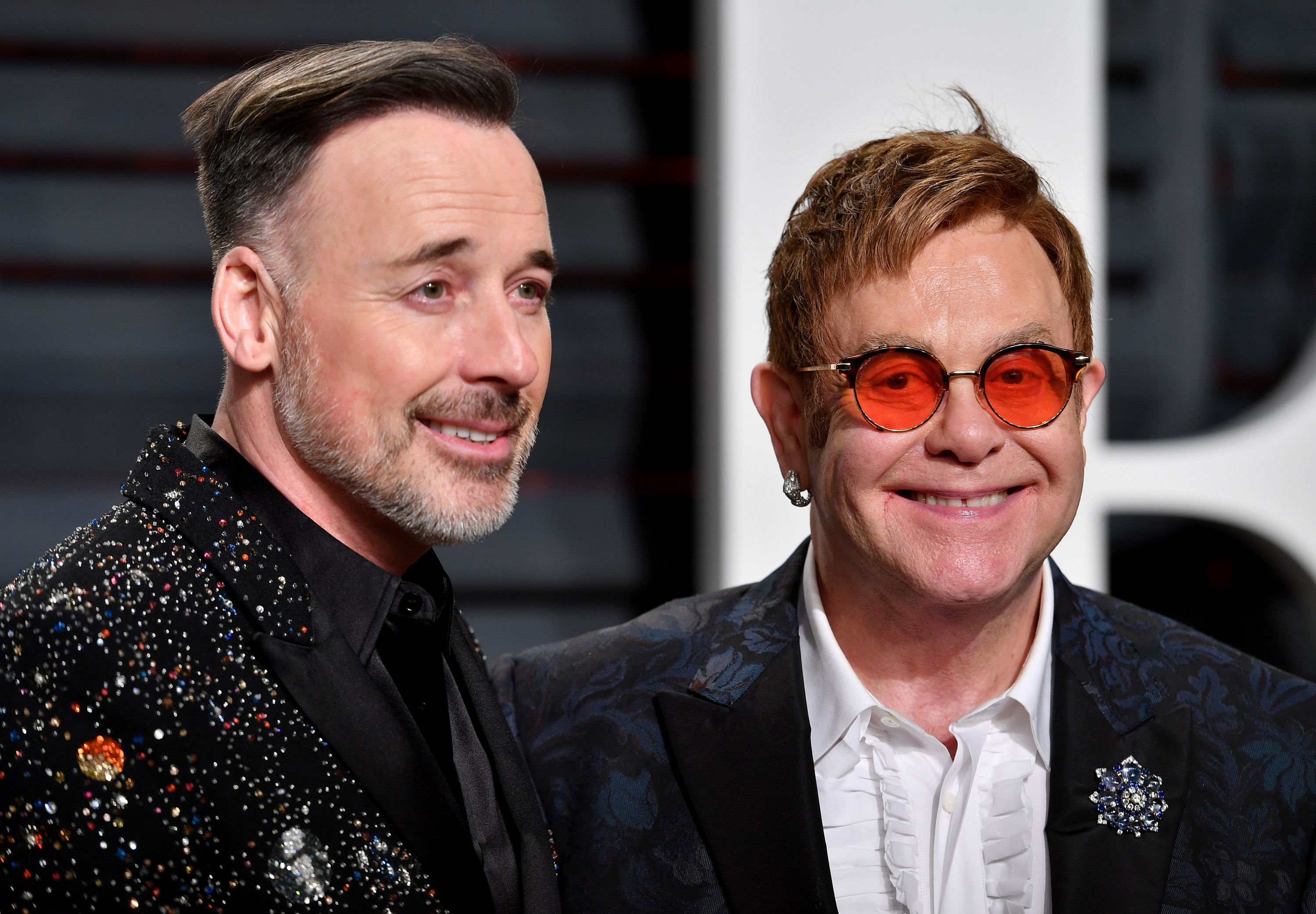 David Furnish and Elton John attend the 2017 Vanity Fair Oscar Party hosted by Graydon Carter at Wallis Annenberg Center for the Performing Arts on February 26, 2017 in Beverly Hills, California.