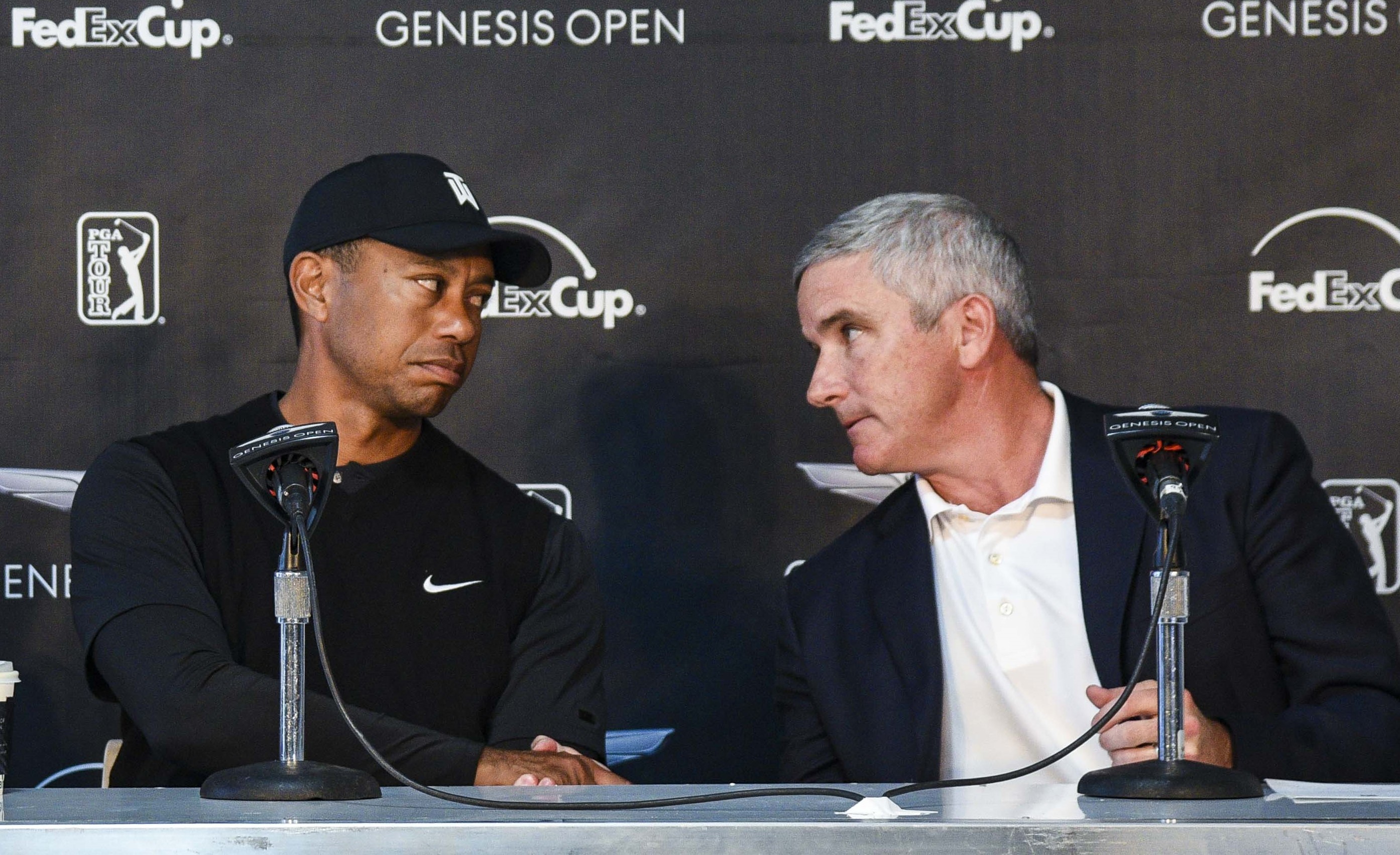 Tiger Woods and PGA Tour commissioner Jay Monahan.