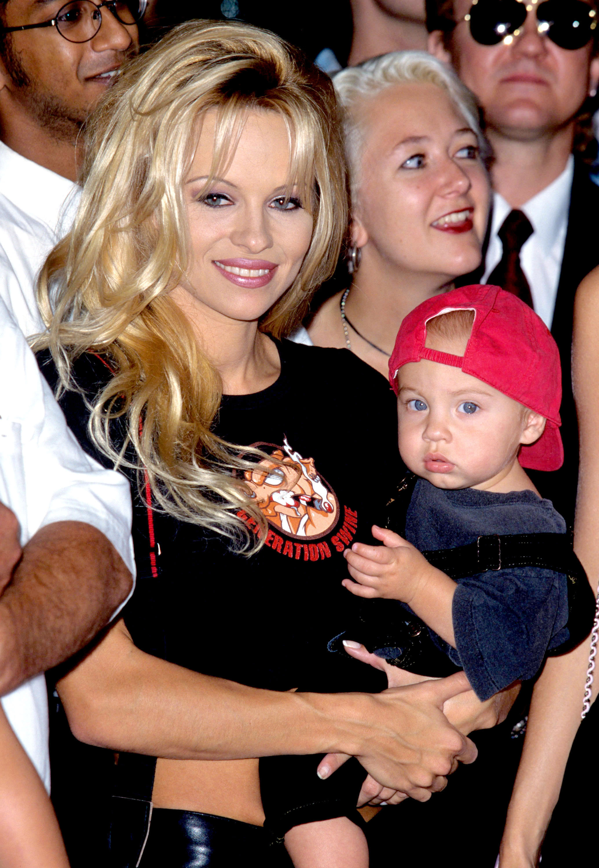 Pamela Anderson and son Brandon during Motley Crue Puts Hands in Cement in RockWalk at Guitar Center in Hollywood, California, United States. 