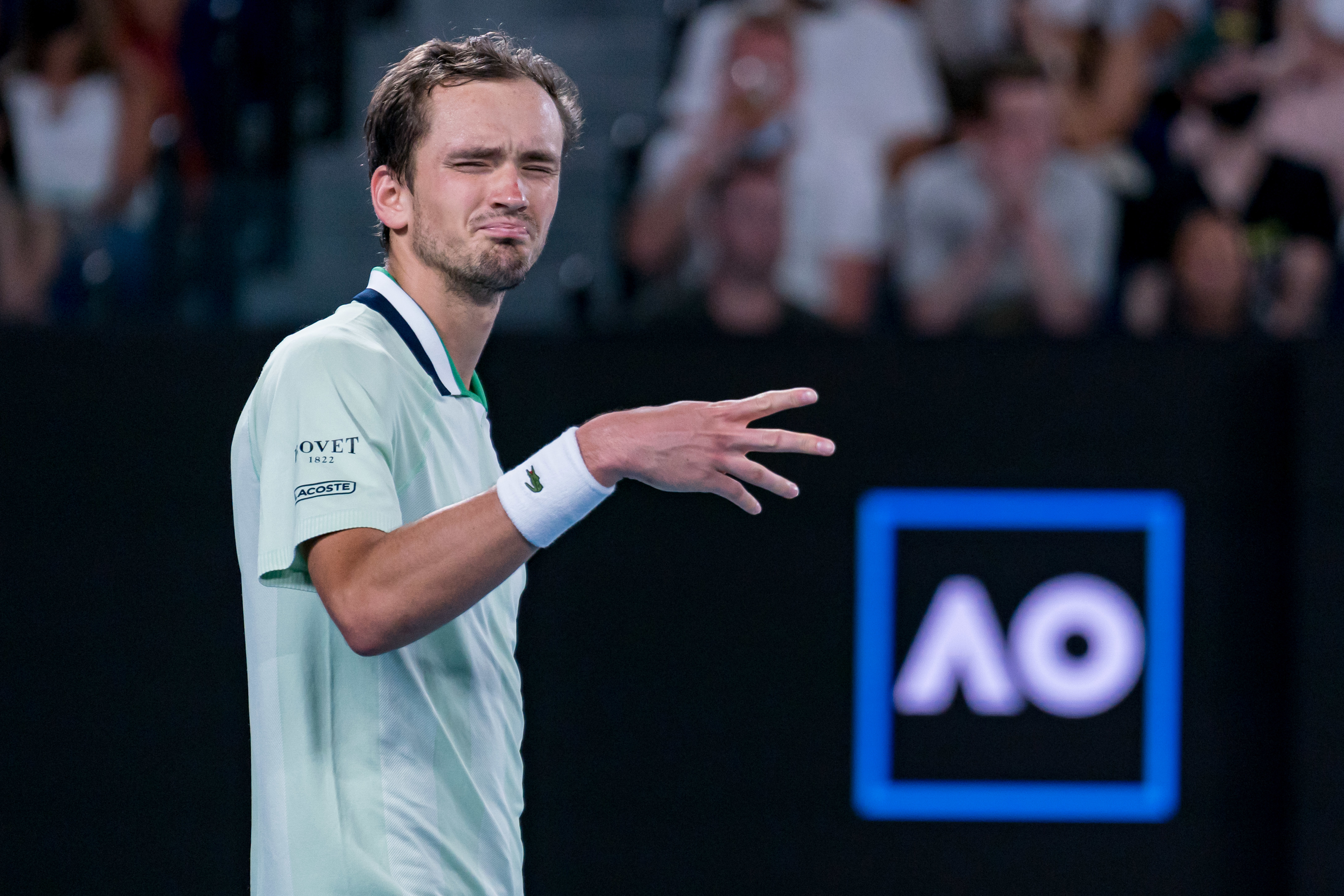 Daniil Medvedev gestures to the raucous crowd at the Australian Open.