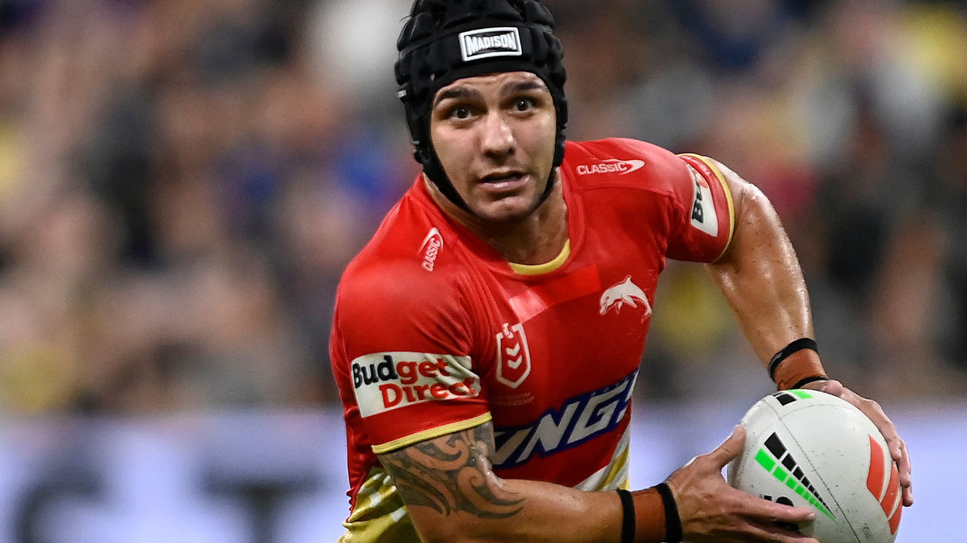 Kodi Nikorima runs the ball for the Dolphins.