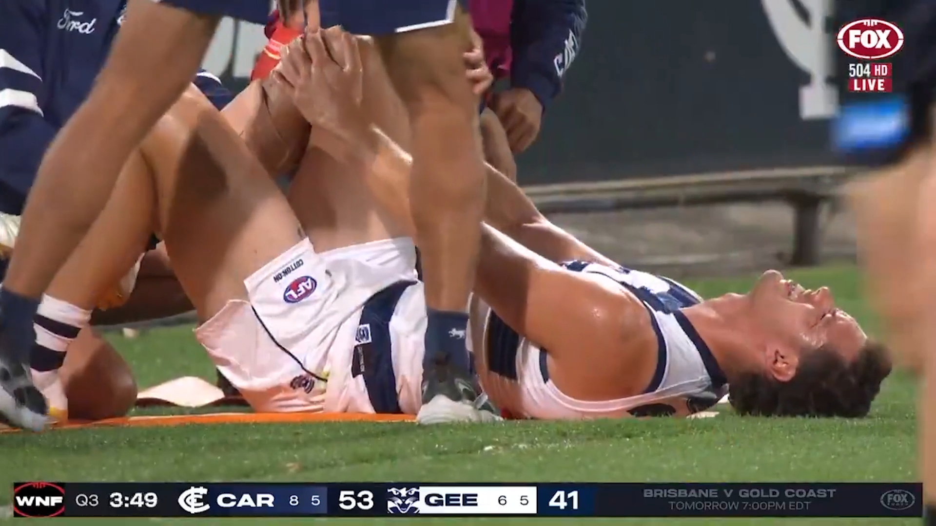 Shannon Neale holding his knee in pain.