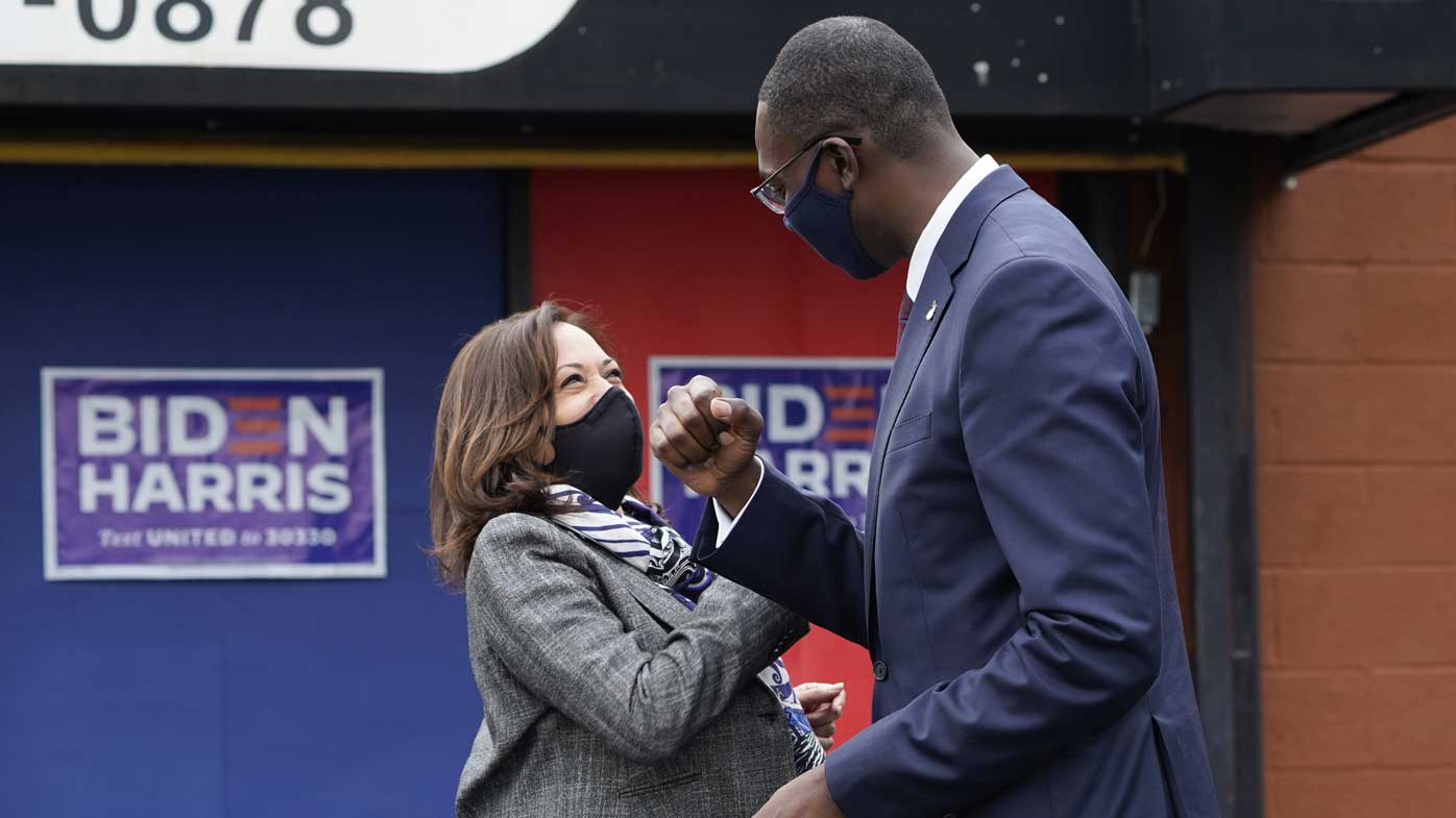 Vice Presidential candidate Kamala Harris greets Michigan's Lt Governor Garlin Gilchrist in Detroit.