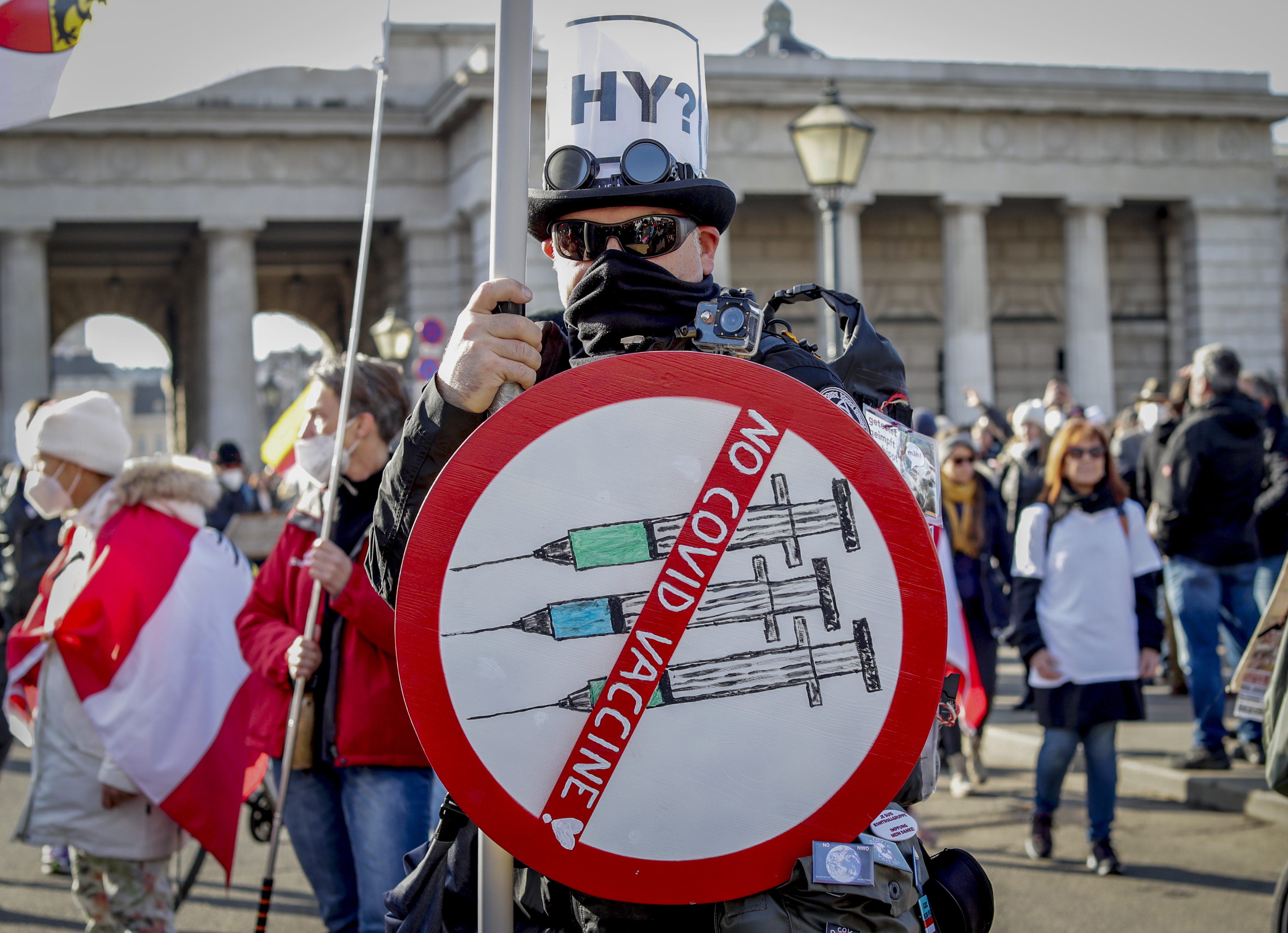 People take part in a demonstration against the country's coronavirus restrictions in Vienna, Austria