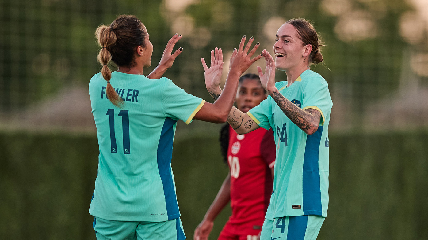 Sharn Freier and Mary Fowler celebrate the former's goal against Canada in the Matildas' final pre-Olympics match against Canada.