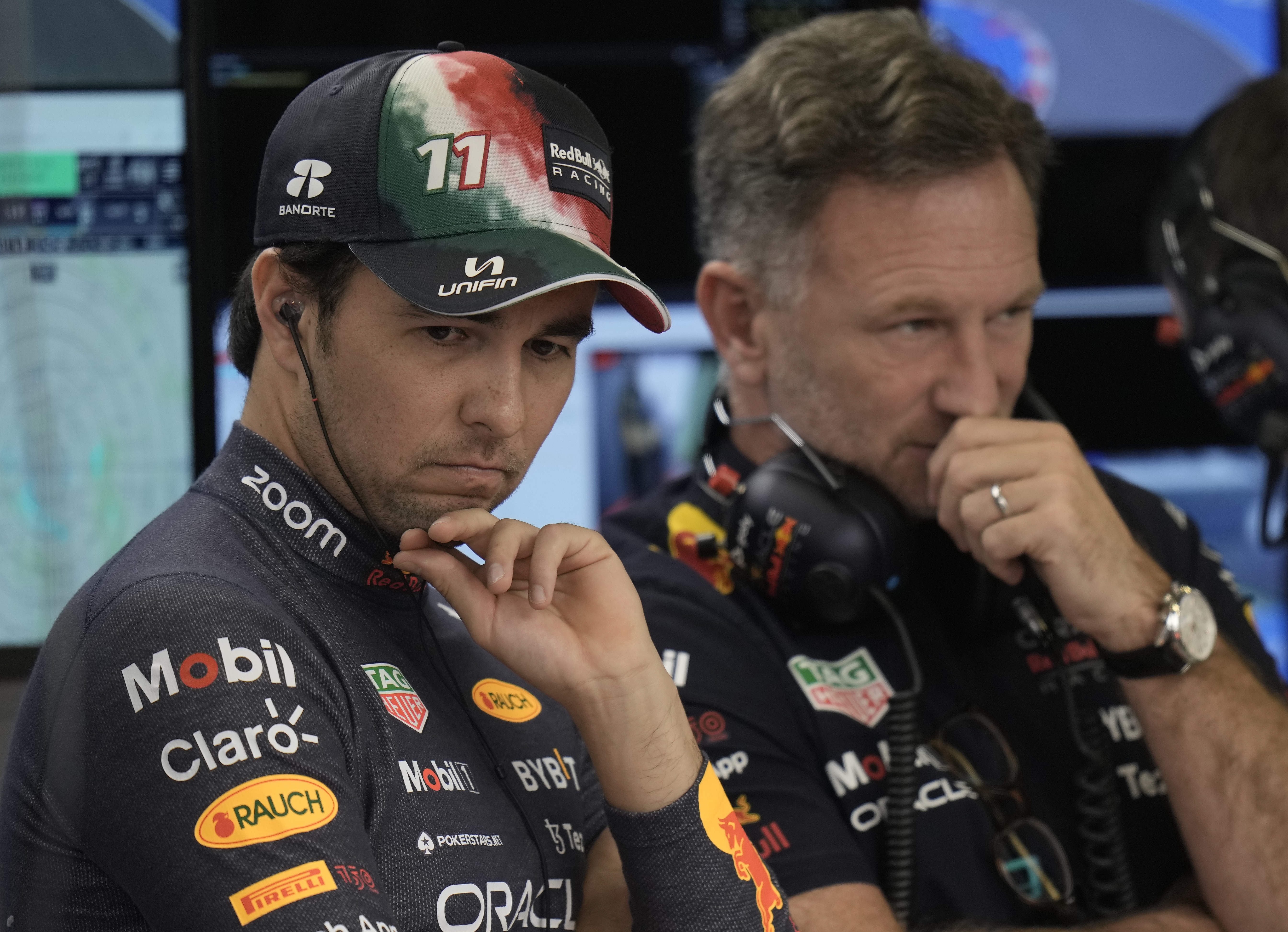 Sergio Perez talks with Red Bull team principal Christian Horner.
