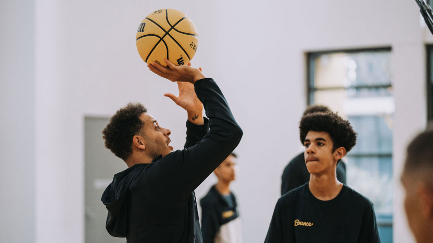 Seth Curry during basketball clinic with kids in Australia