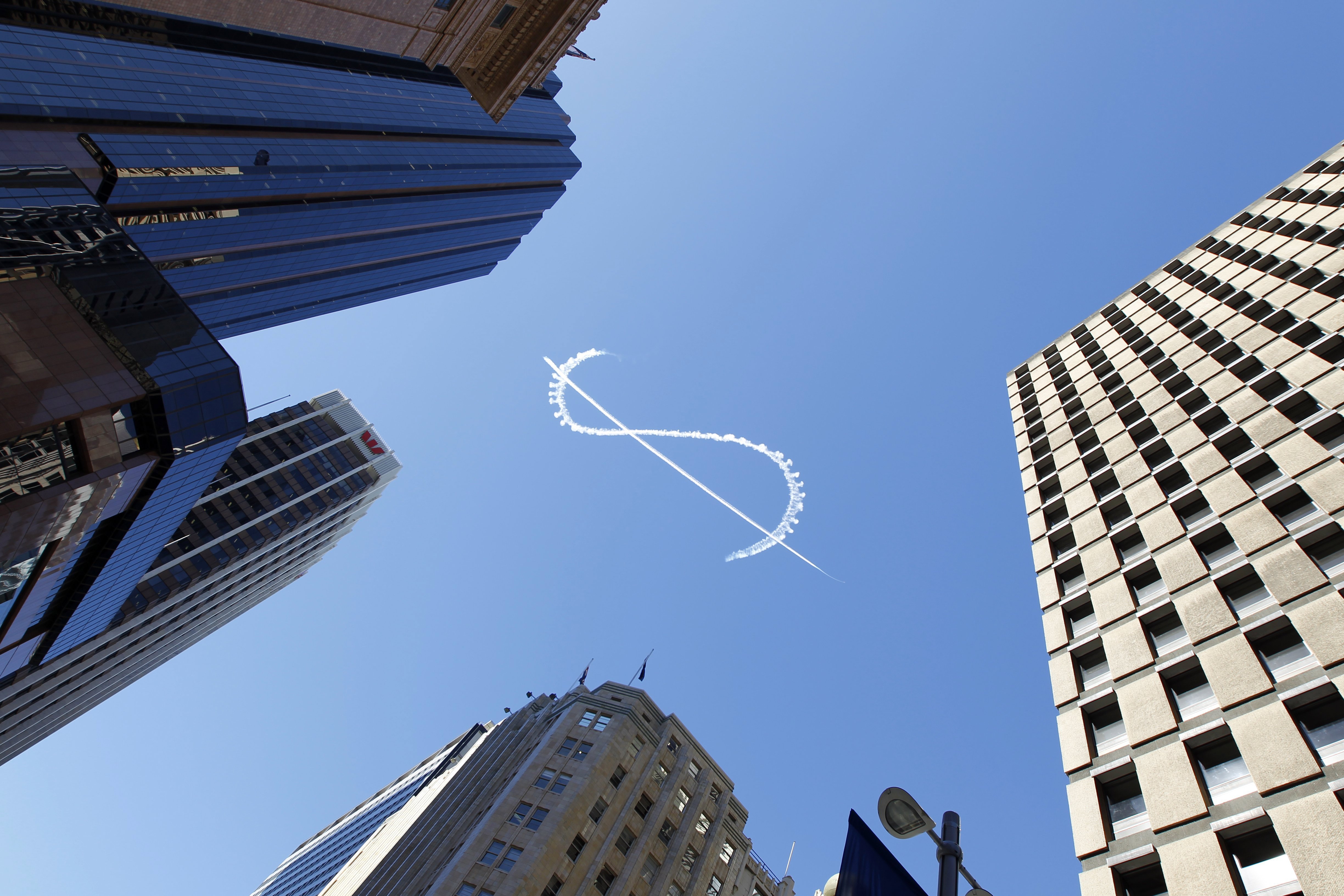 A dollar sign written in the sky, high above Martin Place