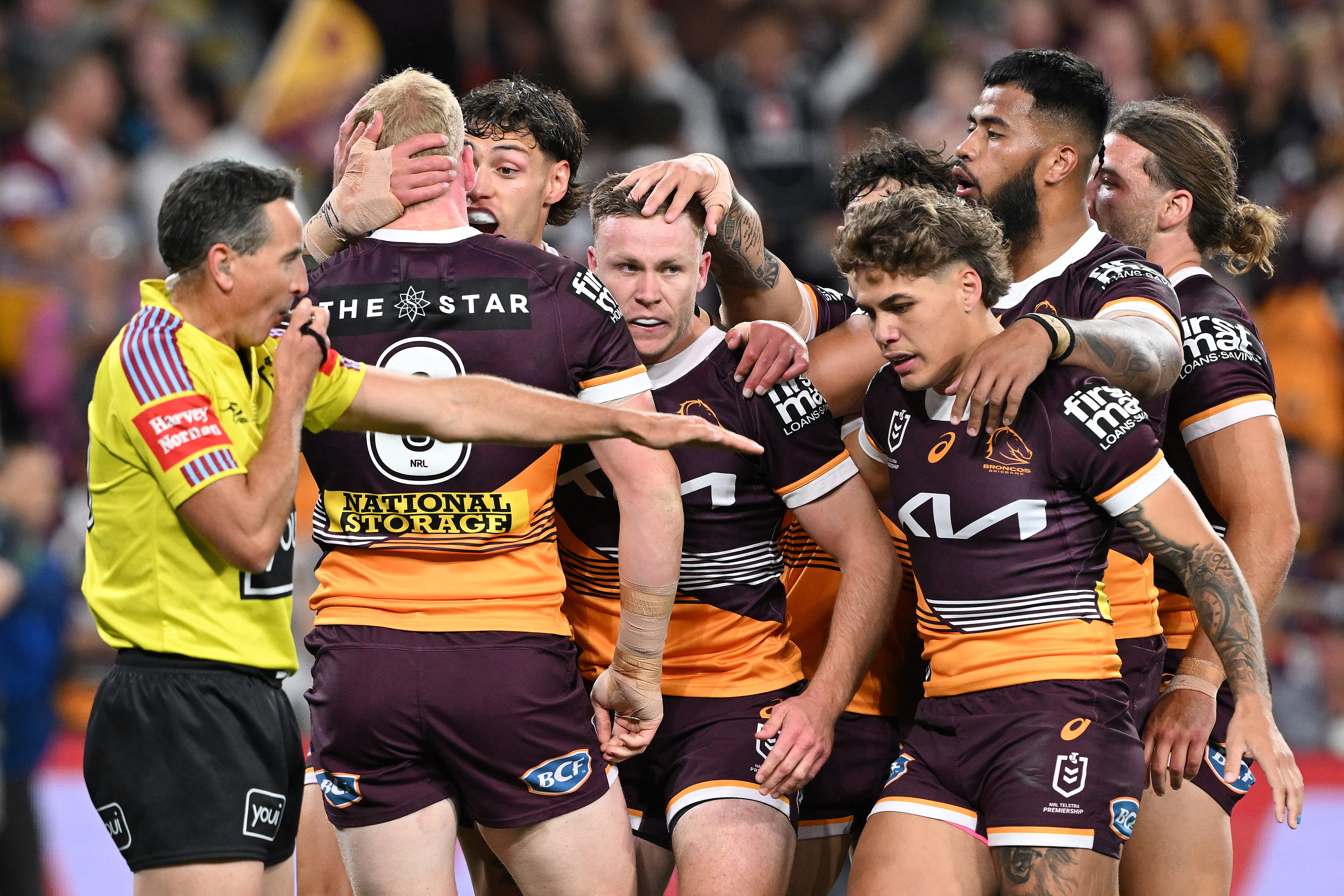 Billy Walters celebrates with Broncos teammates.