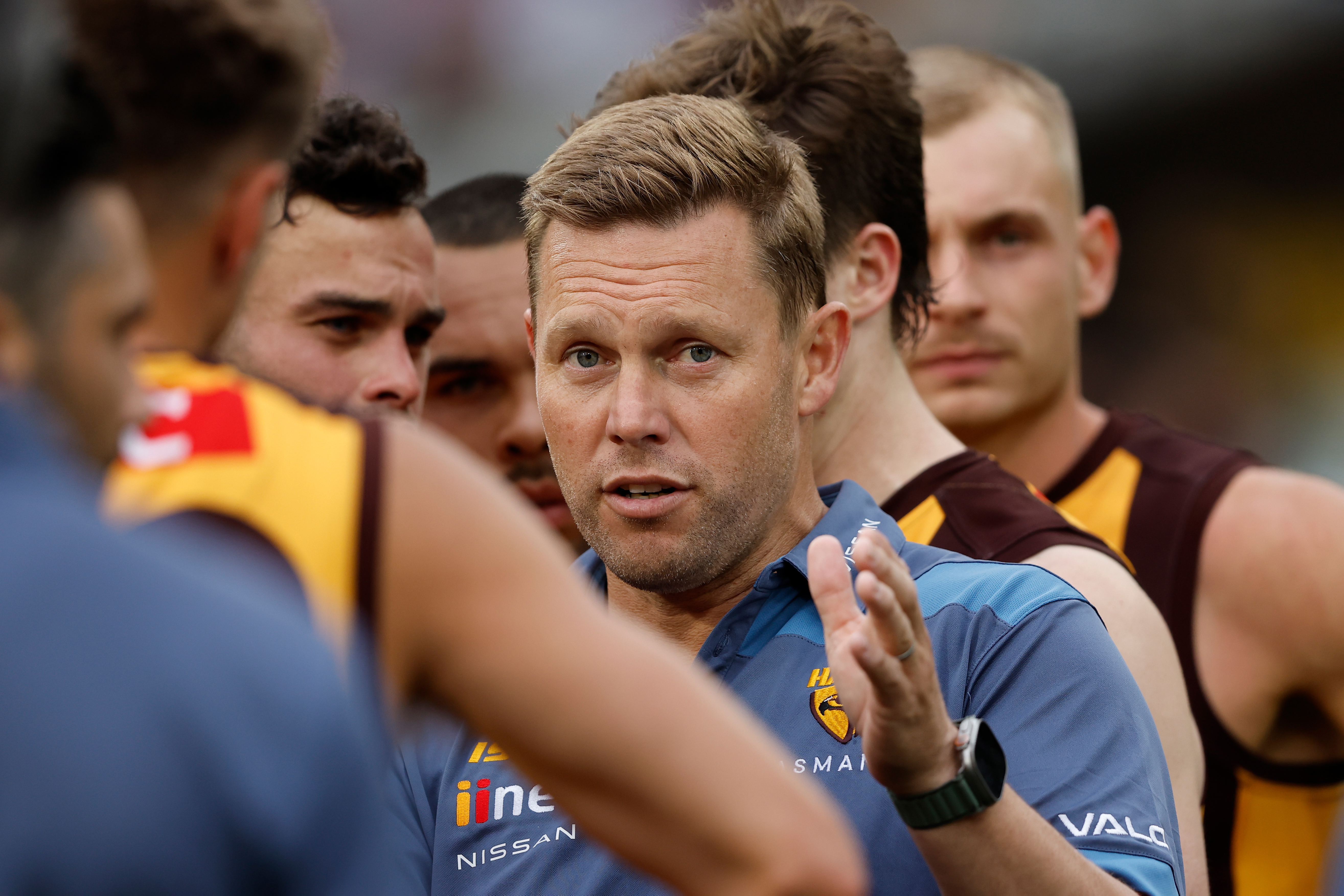 MELBOURNE, AUSTRALIA - MARCH 19: Sam Mitchell, Senior Coach of the Hawks addresses his players during the 2023 AFL Round 01 match between the Hawthorn Hawks and the Essendon Bombers at the Melbourne Cricket Ground on March 19, 2023 in Melbourne, Australia. (Photo by Dylan Burns/AFL Photos)