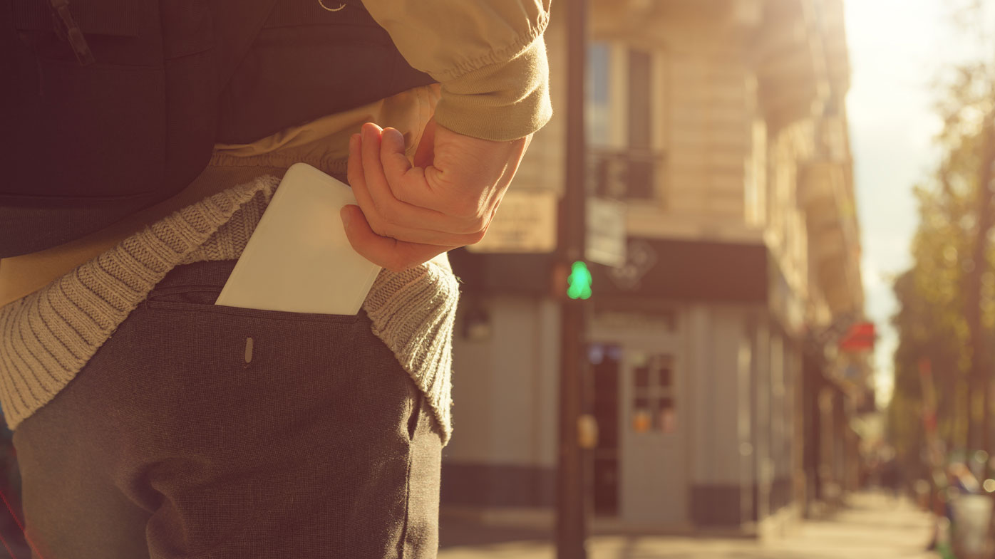 Phone pocket walking down the street generic image.