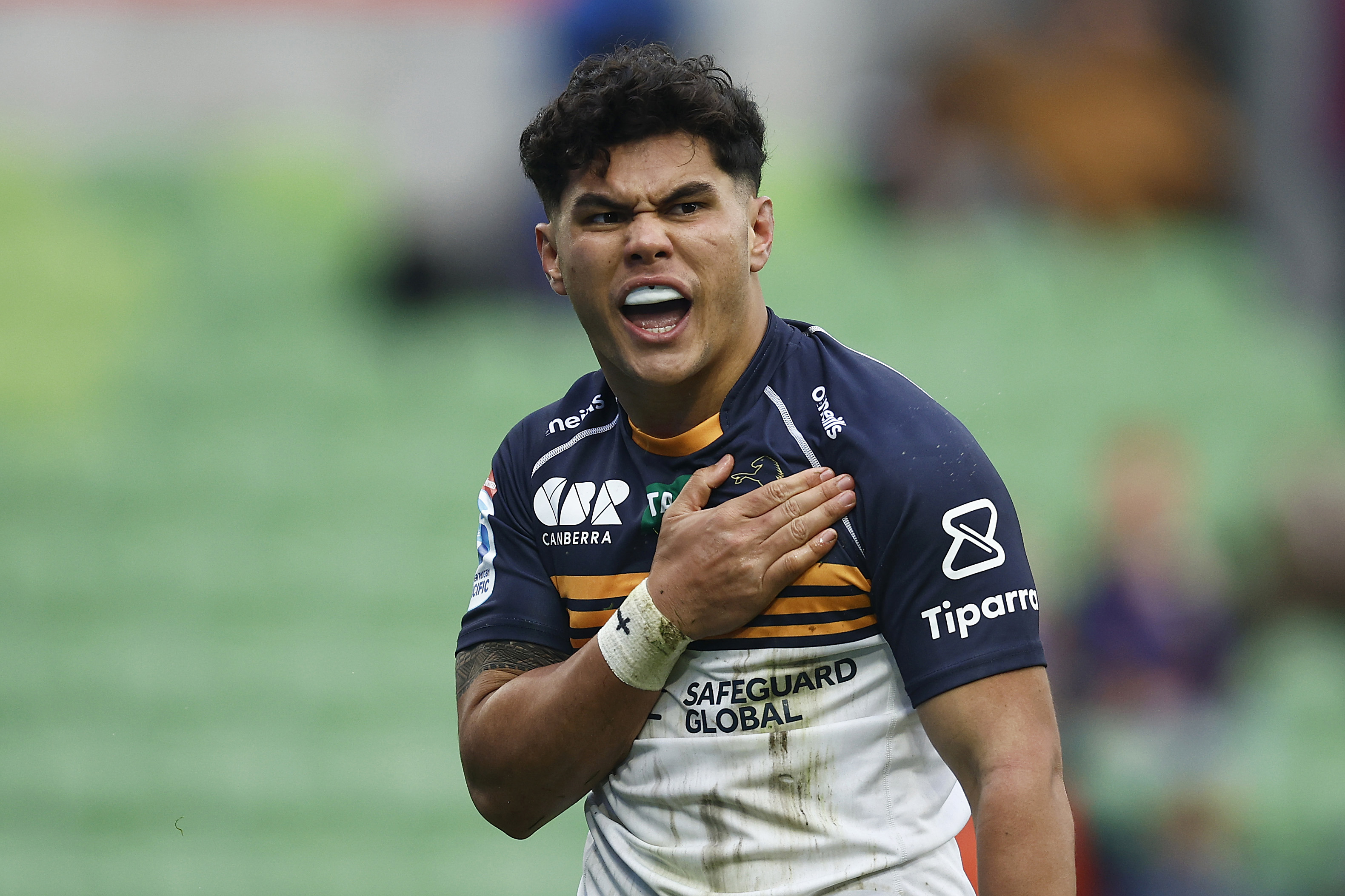 Noah Lolesio pounds his chest after scoring the first try for the Brumbies against the Rebels.