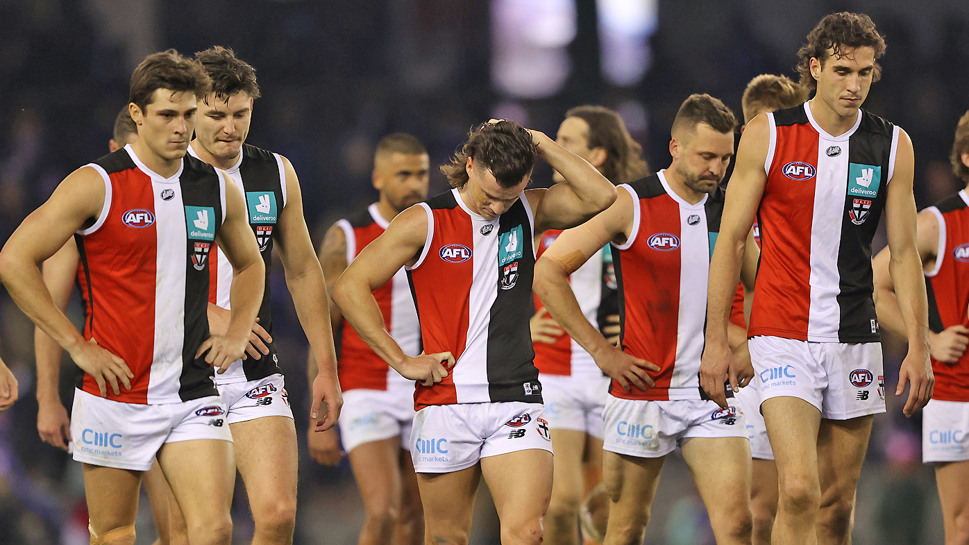 The Saints walk off after they were defeated by the Bulldogs 
