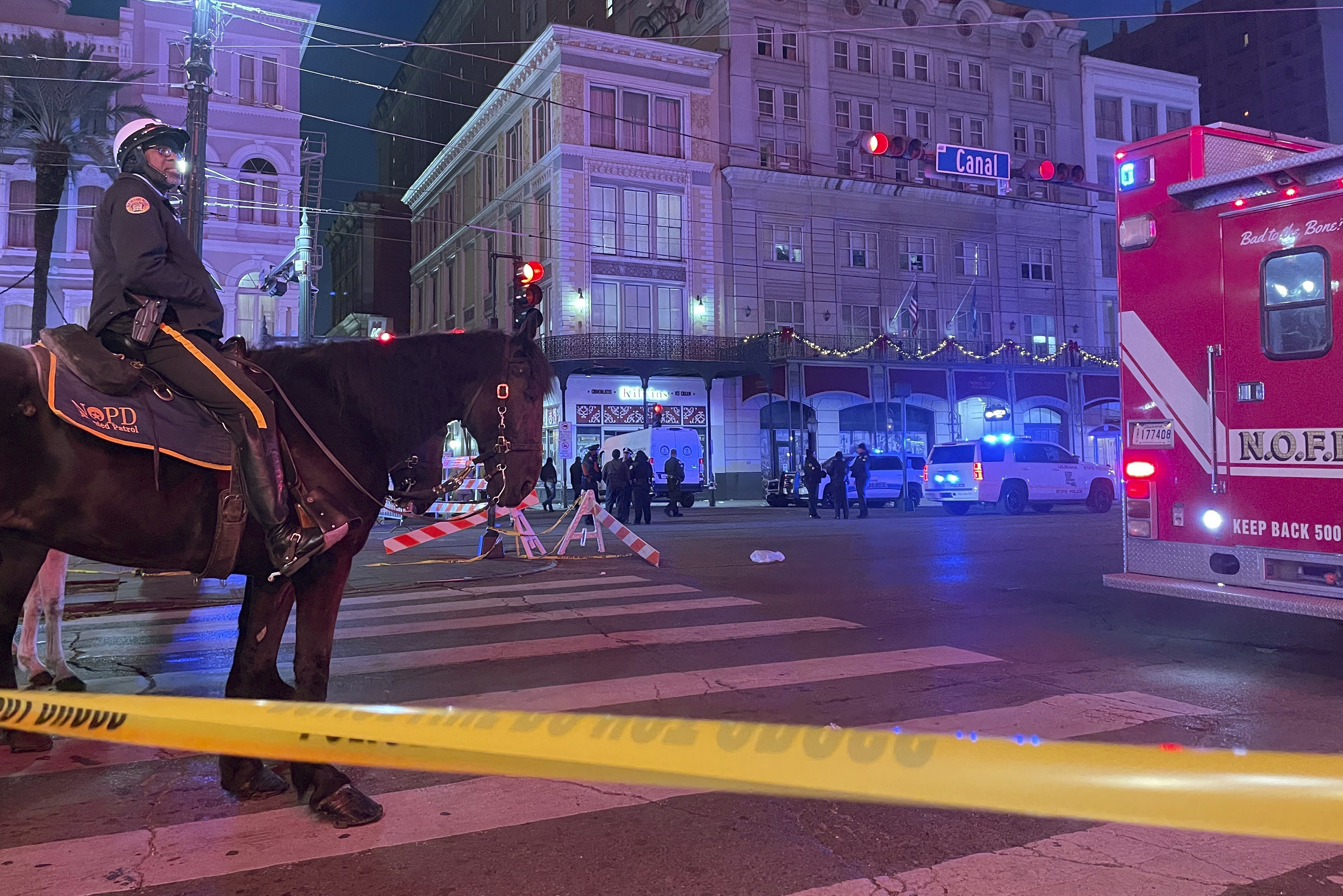 A mounted police officer arrives on Canal Street after a vehicle drove into a crowd earlier in New Orleans, Wednesday Jan. 1, 2025. 