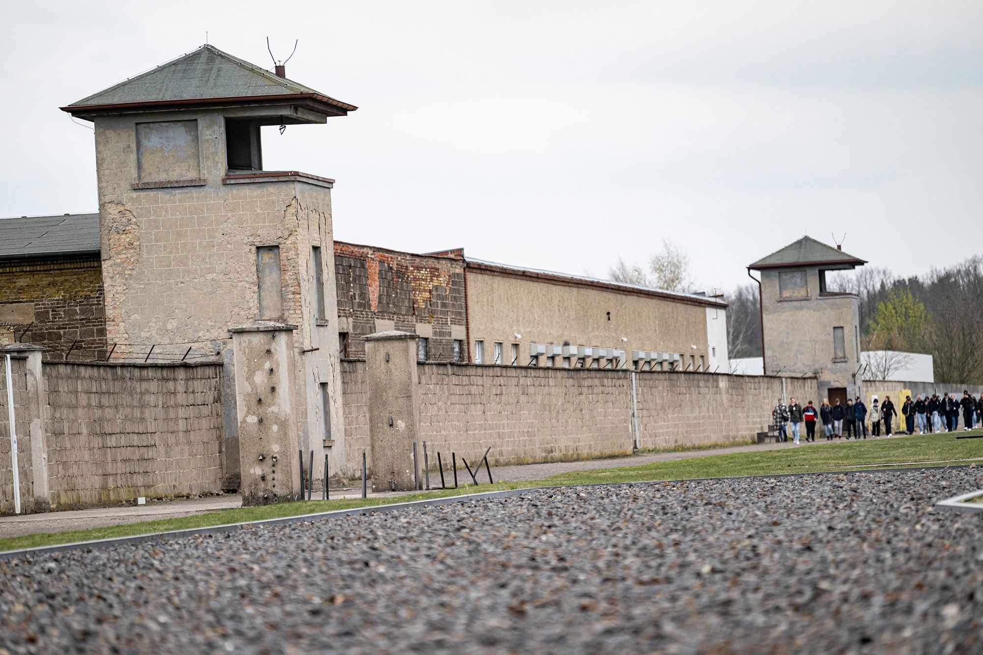 People walk the grounds of the former concentration camp at the Sachsenhausen Memorial.