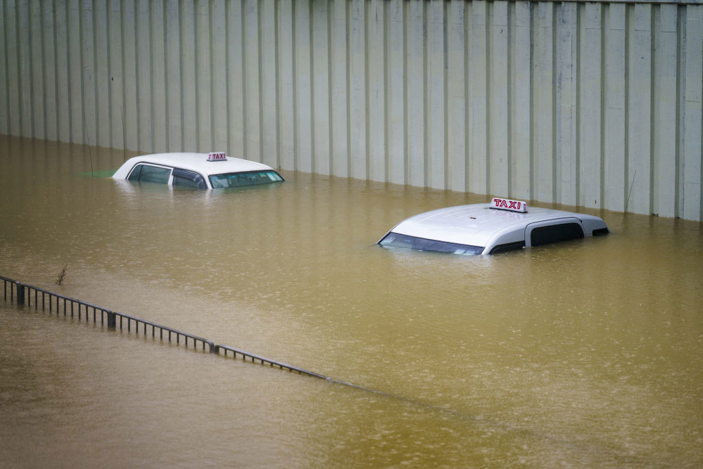 Taxis submerged in floodwater during heavy rain in Hong Kong, China, on Sept. 8, 2023. Hong Kongs heaviest rainstorm since records began in 1884 flooded the financial hubs streets and sent torrents of water rushing through subway stations, bringing much of the city to a standstill and forcing the stock market to halt morning trading on Friday. Photographer: Justin Chin/Bloomberg