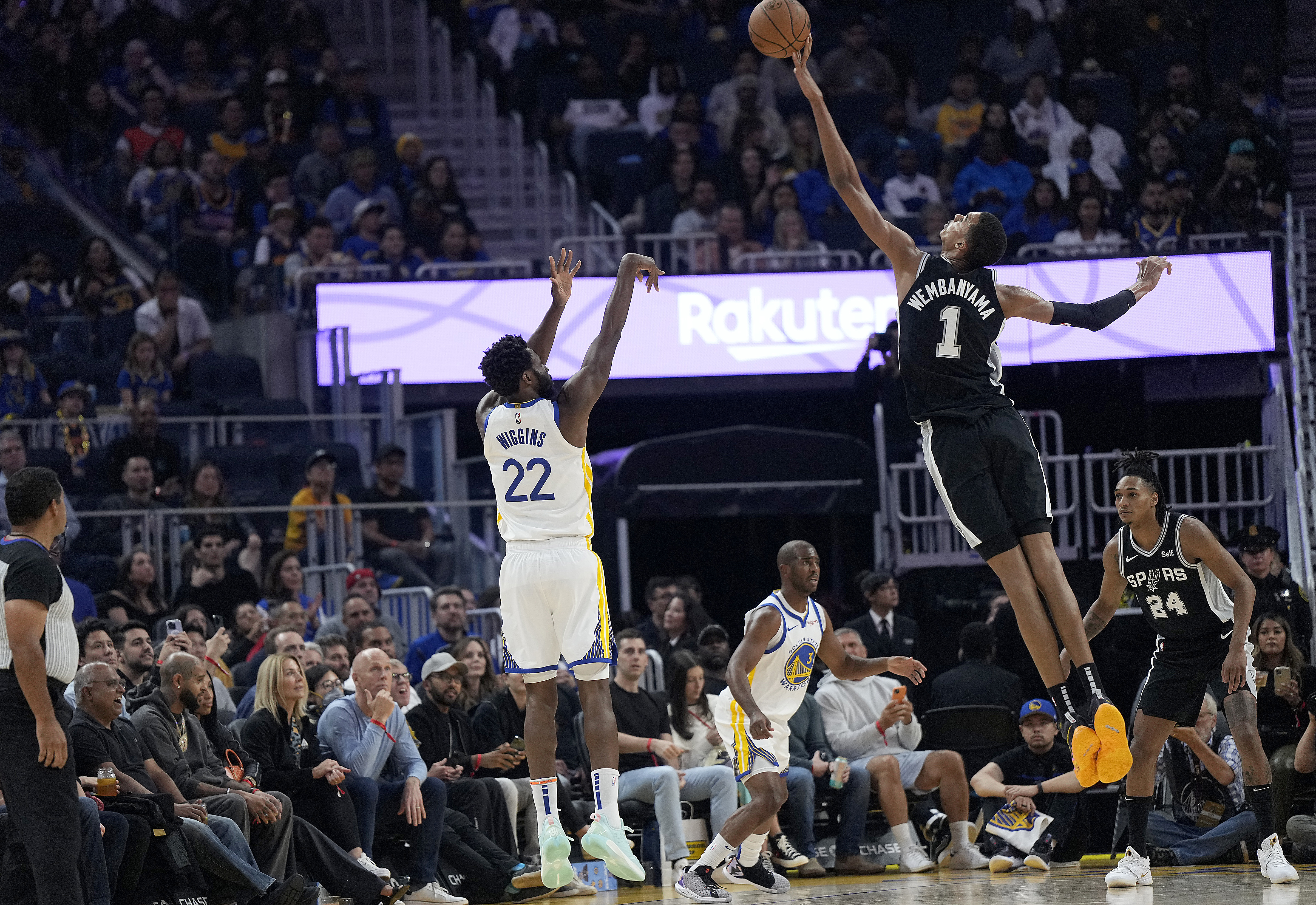 SAN FRANCISCO, CALIFORNIA - OCTOBER 20: Victor Wembanyama #1 of the San Antonio Spurs blocks the shot of Andrew Wiggins #22 of the Golden State Warriors during the first half of an NBA basketball game at Chase Center on October 20, 2023 in San Francisco, California. 