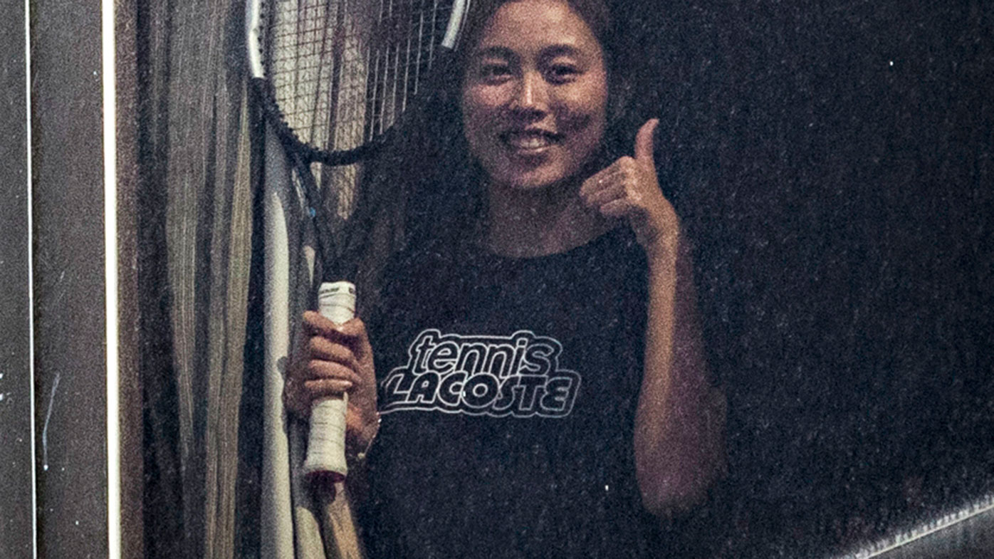 Angel Chan gives the thumbs up from her hotel quarantine at the View hotel ahead of the Australian Open in Melbourne.
