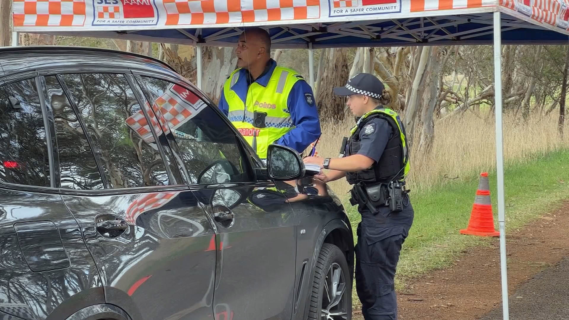 Police officers on the scene after a fatal crash in country Victoria.