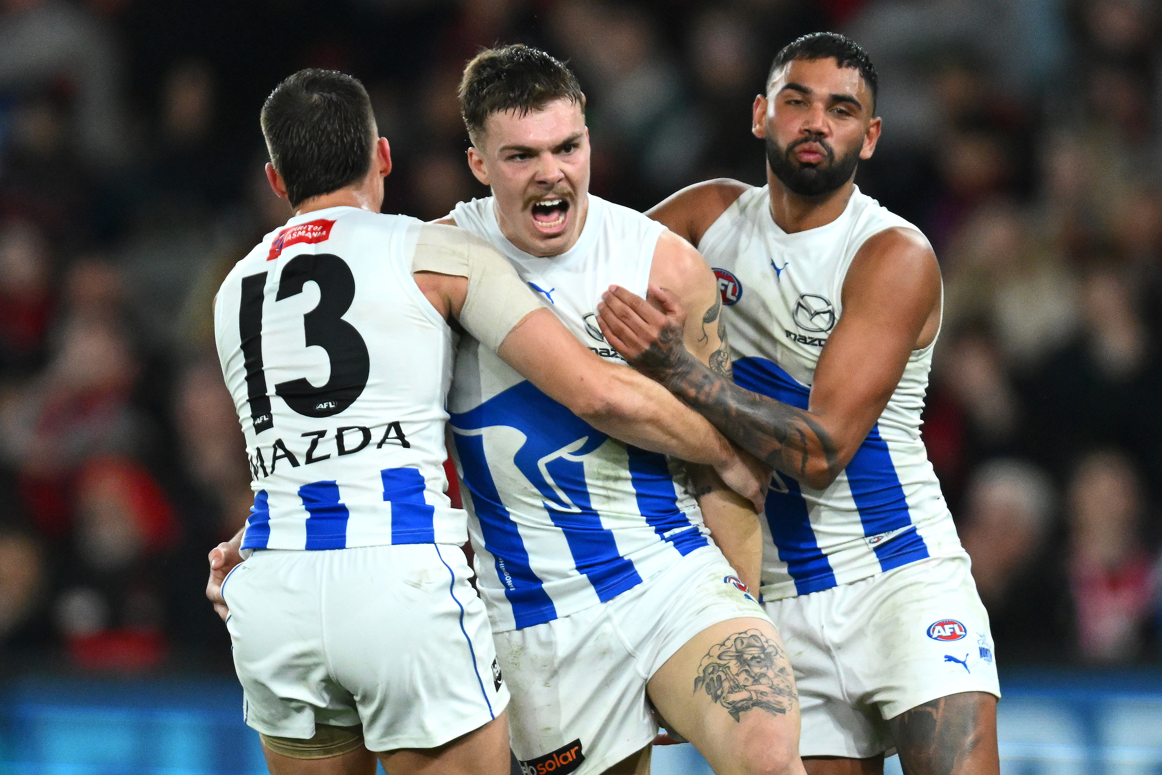 MELBOURNE, AUSTRALIA - JUNE 04: Cameron Zurhaar of the Kangaroos celebrates kicking a goal during the round 12 AFL match between Essendon Bombers and North Melbourne Kangaroos at Marvel Stadium, on June 04, 2023, in Melbourne, Australia. (Photo by Quinn Rooney/Getty Images)