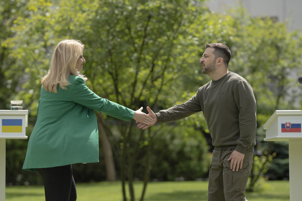 Slovakia's President Zuzana Caputova shakes hands with Ukraine's President Volodymyr Zelenskyy at a joint news conference in Kyiv, Ukraine, Friday, May 10, 2024.