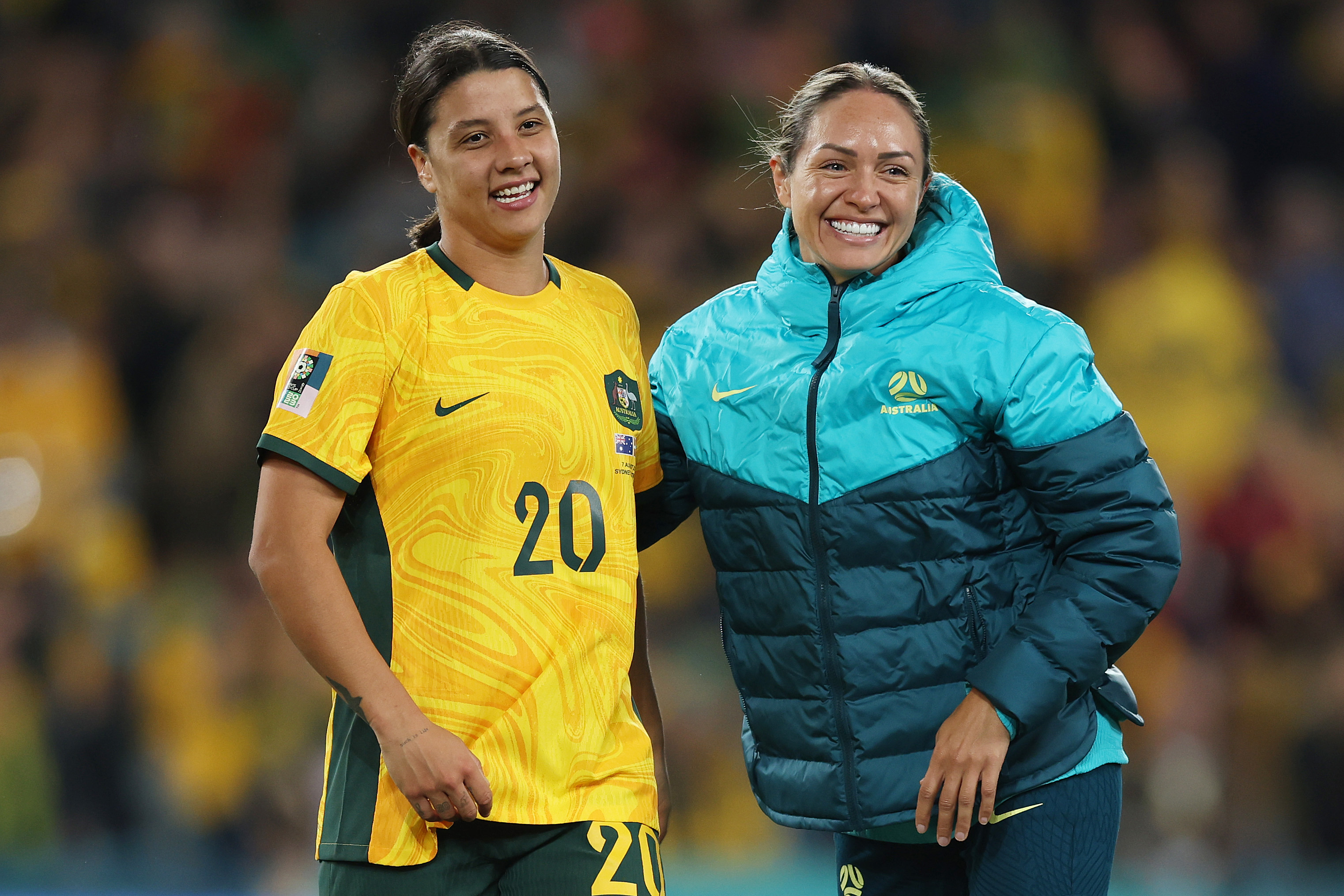 Sam Kerr (L) and Kyah Simon of Australia celebrate the teams 2-0 victory and advance to the quarter final during the FIFA Women's World Cup Australia & New Zealand 2023 Round of 16 match between Australia and Denmark at Stadium Australia on August 07, 2023 in Sydney, Australia. (Photo by Mark Metcalfe - FIFA/FIFA via Getty Images)