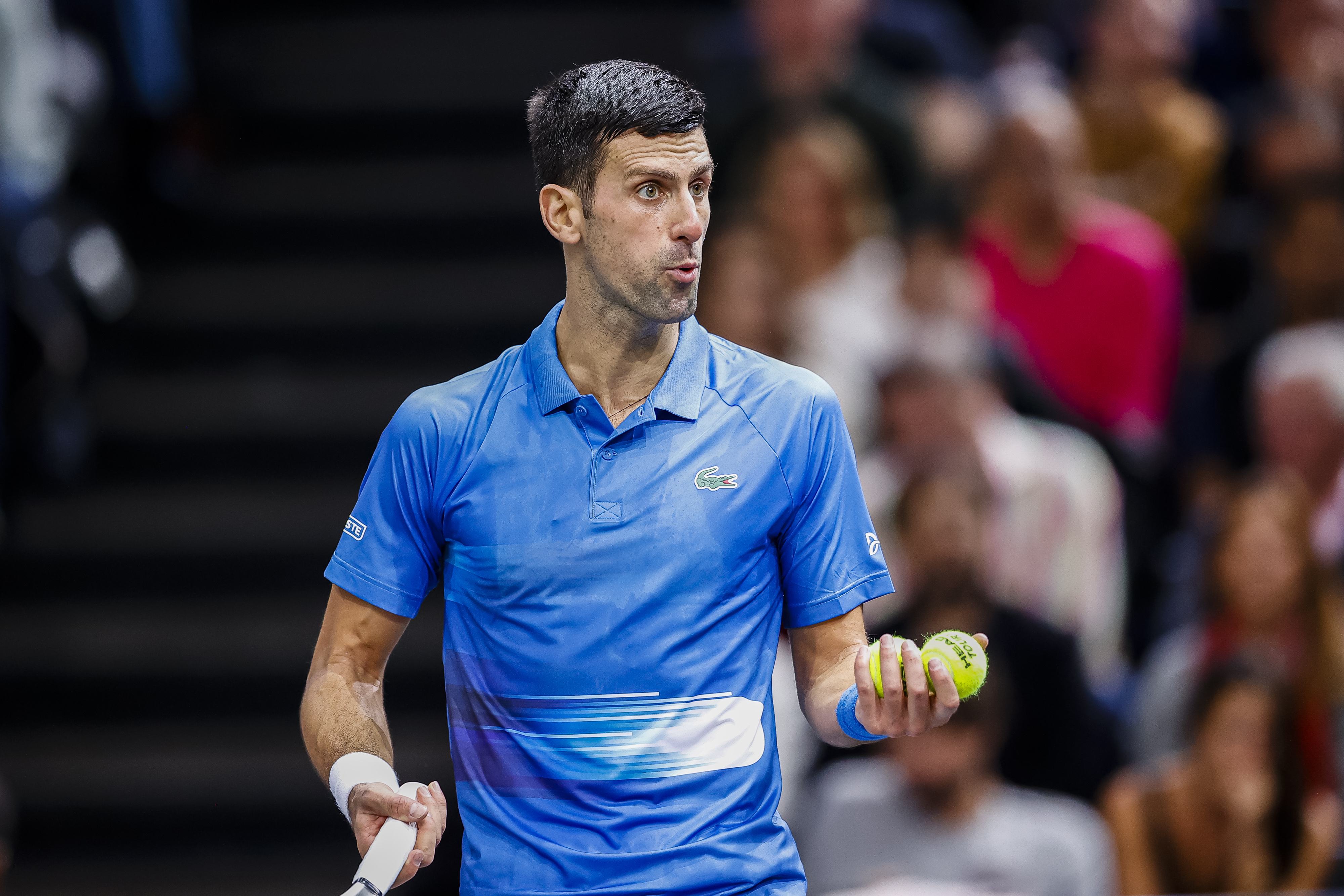Novak Djokovic reacts during his match against Holger Nodskov Rune at the Paris Masters.