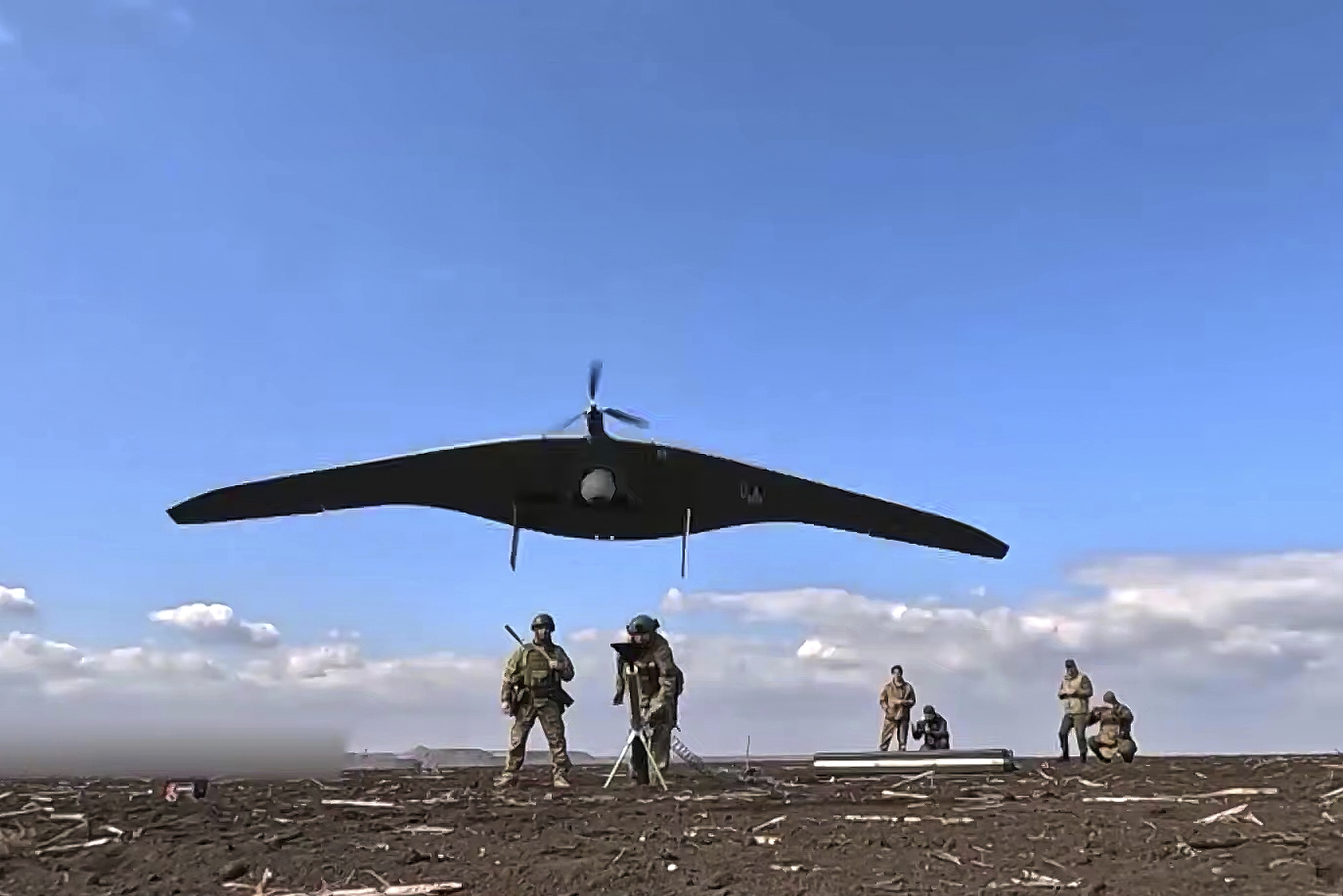 Russian soldiers launch a Supercam intelligence unmanned aerial vehicle 