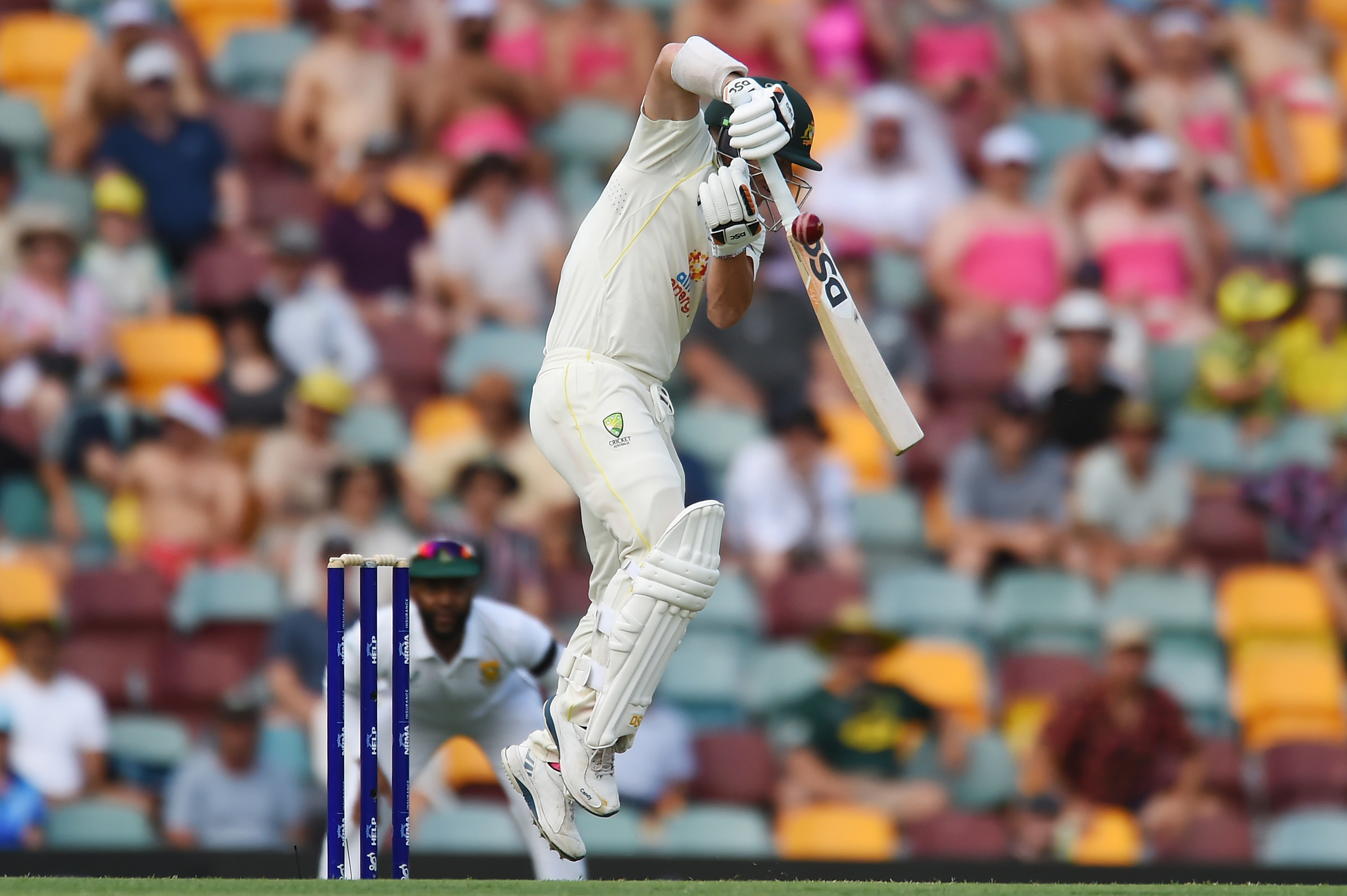 David Warner of Australia plays a shot and is caught by Khaya Zondo of South Africa for a duck during day one of the First Test match between Australia and South Africa at The Gabba on December 17, 2022 in Brisbane, Australia. (Photo by Albert Perez/Getty Images)
