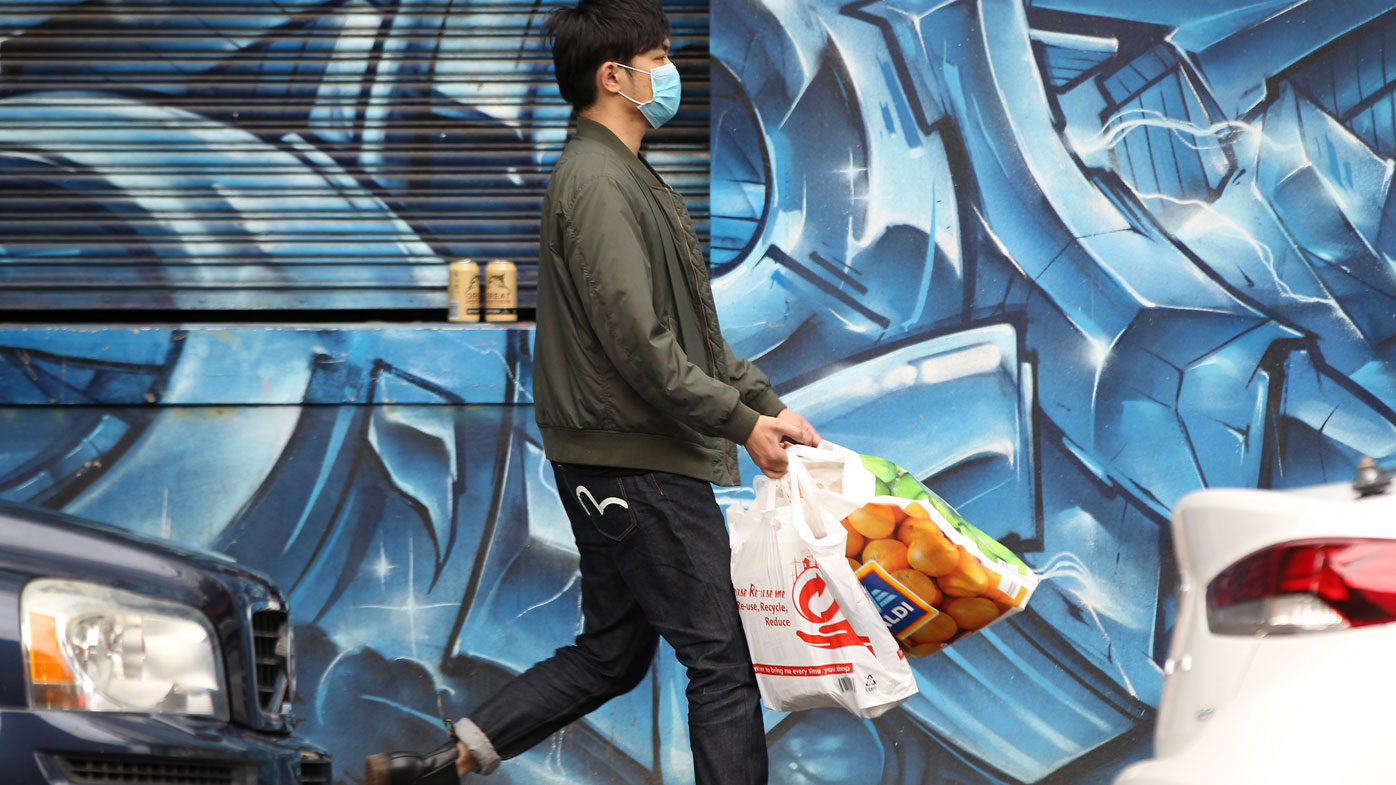 A man is seen wearing a face mask to protect himself from coronavirus in Melbourne.