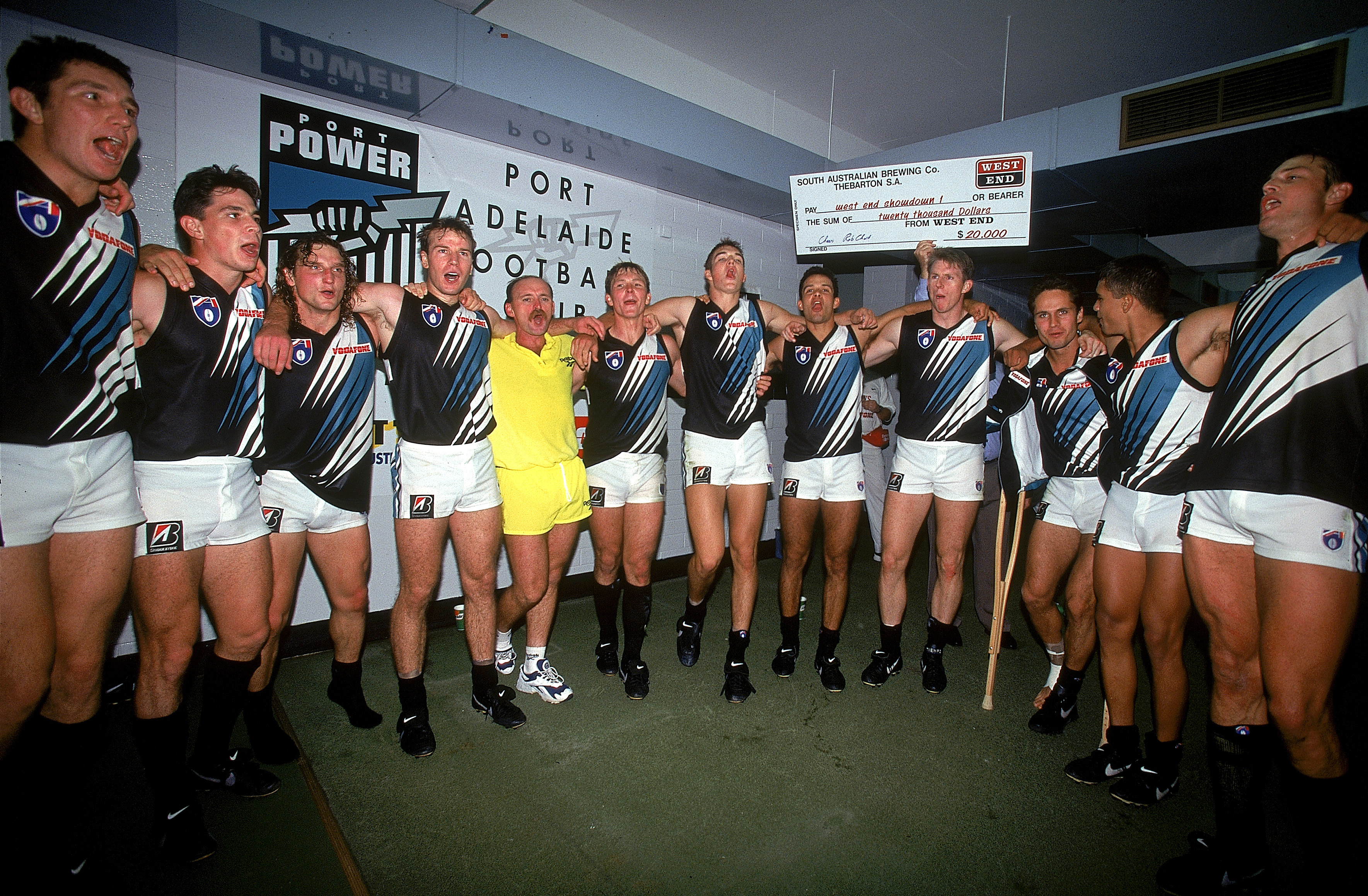 ADELAIDE, AUSTRALIA - APRIL 20: Port Adelaide Power celebrate after the teams win during the round four AFL match between the Port Adelaide Power and the Adelaide Crows held at Football Park April 20, 1997 in Adelaide, Australia. This was the first match between the two South Australian teams. (Photo by Sean Garnsworthy/Getty Images)