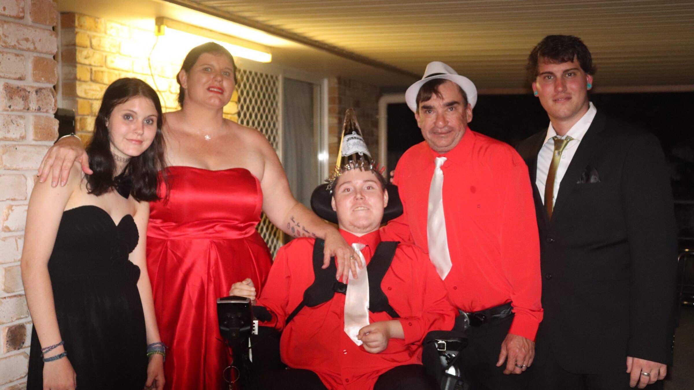 Christian Dean (centre) pictured with his sister Bria, mum Louise, dad Aaron and brother Jesse at his 21st and parents 40th birthday party last year.