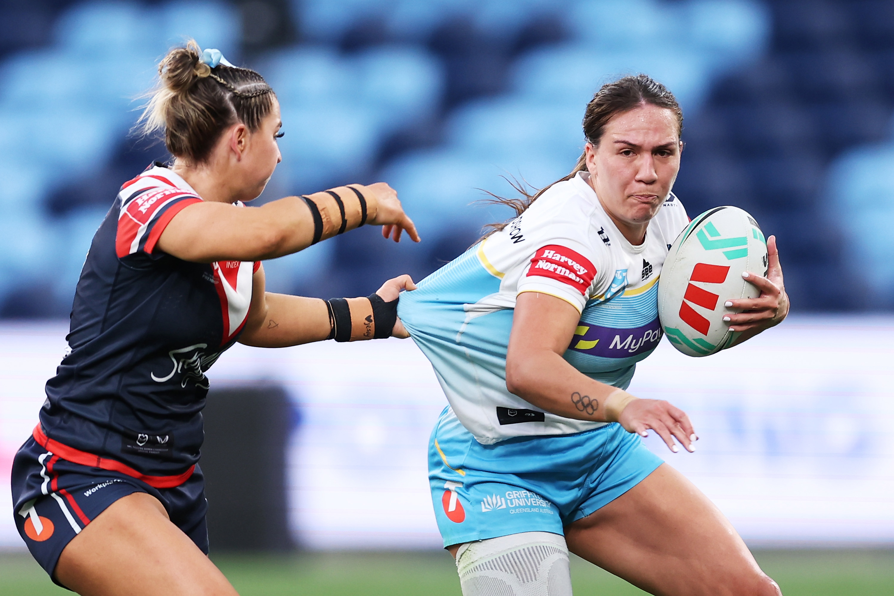 Evania Pelite of the Titans is tackled.
