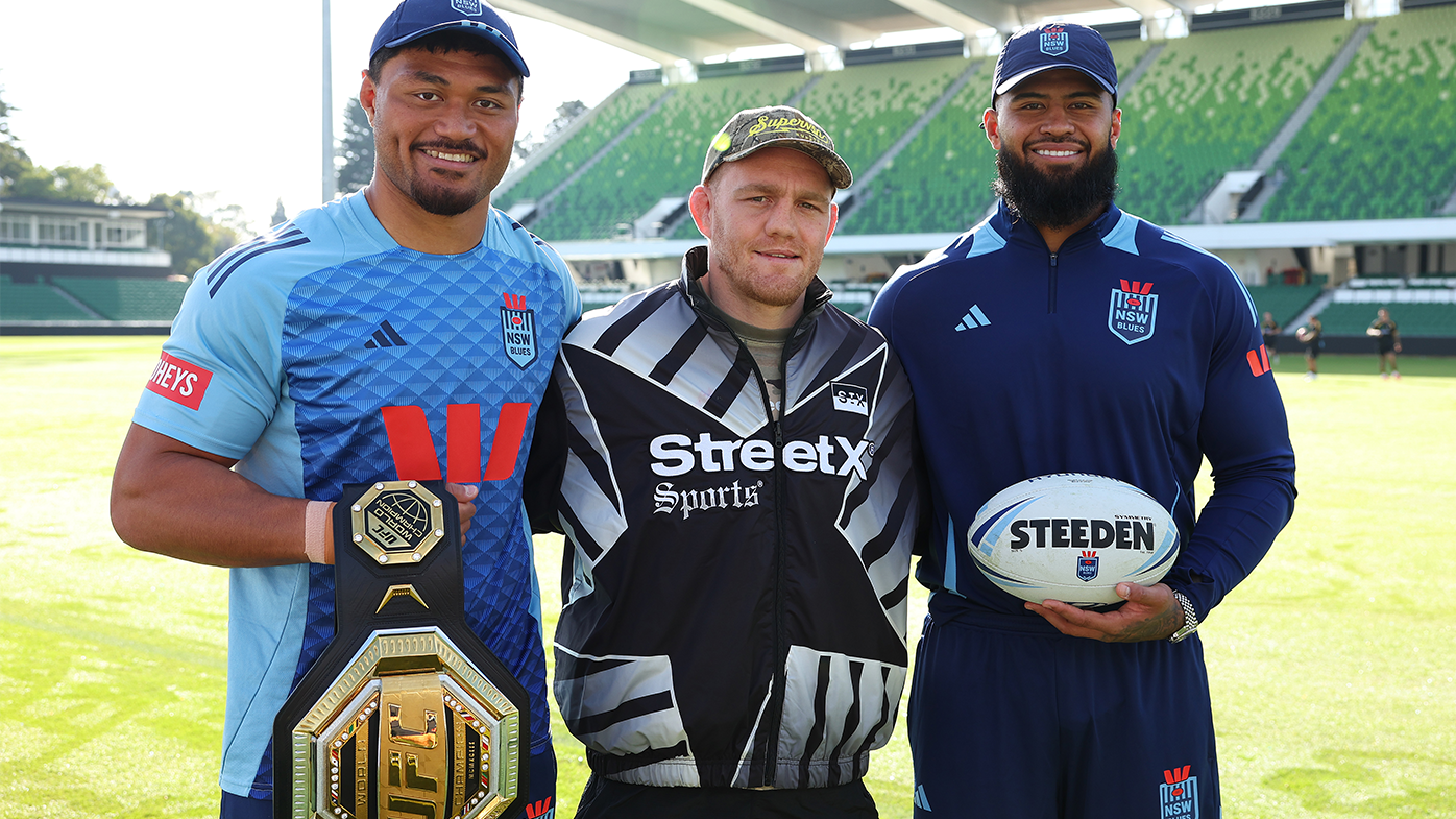 UFC Welterweight World Champion Jack Della Maddalena poses with Stefano Utoikamanu and Payne Haas during a NSW Blues State of Origin training session.