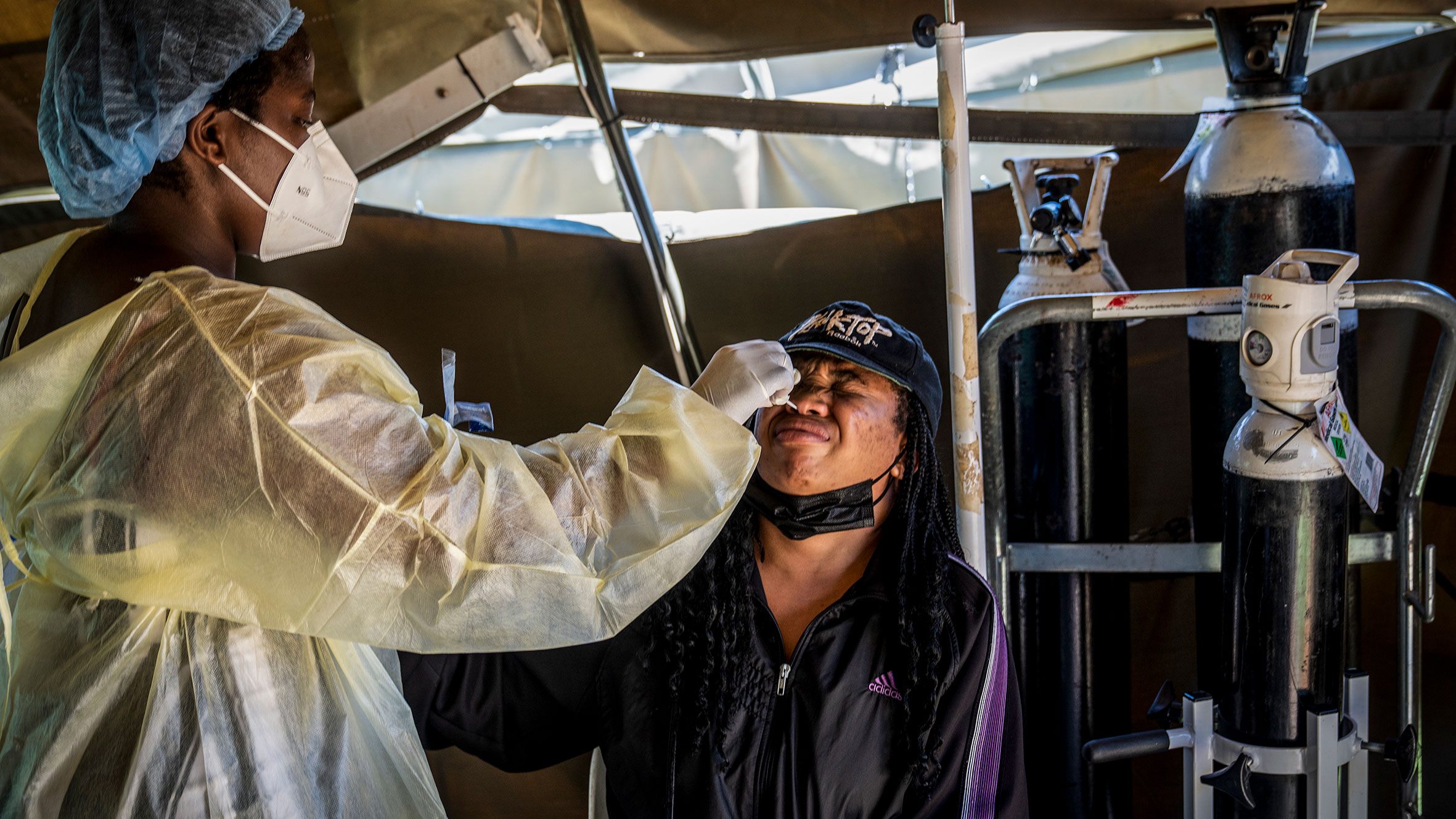 A woman is tested for COVID-19 at the Lenasia South Hospital, near Johannesburg, South Africa.