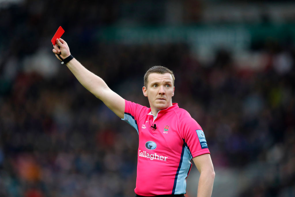 Referee Tom Foley shows a red card at Welford Road Stadium.