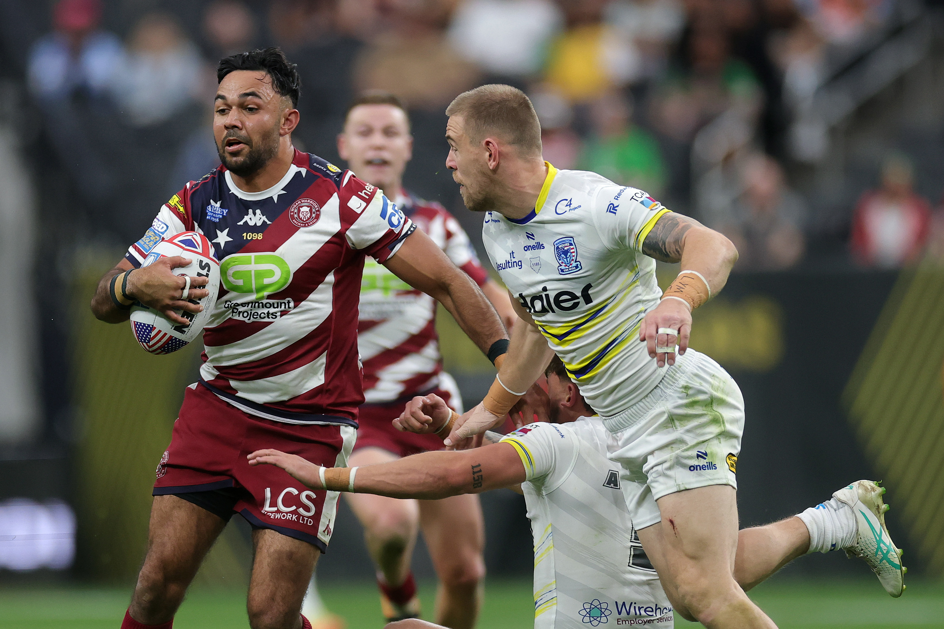 Bevan French of the Wigan Warriors runs the ball at Allegiant Stadium in Las Vegas.