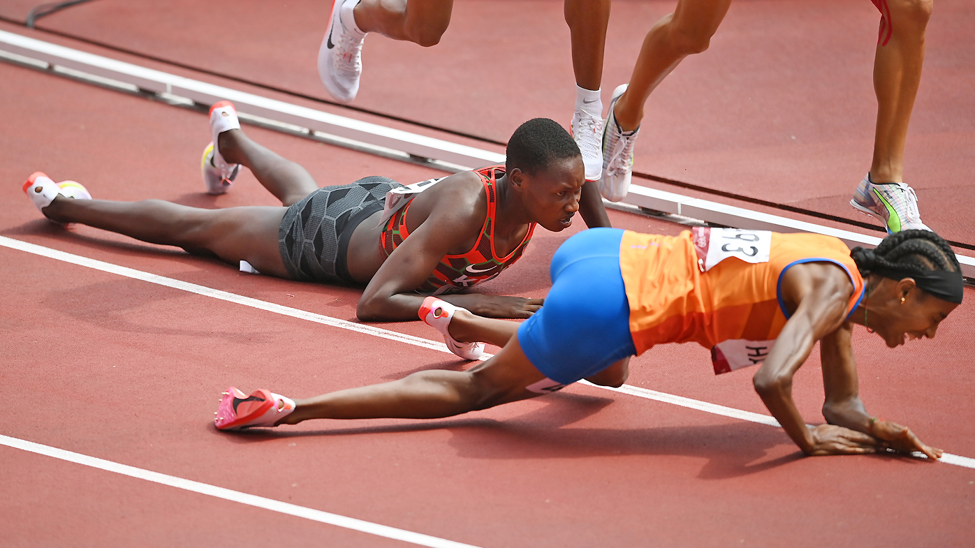 Sifan Hassan of Team Netherlands and Edinah Jebitok of Team Kenya trip and fall during round one of the Women's 1500m heats