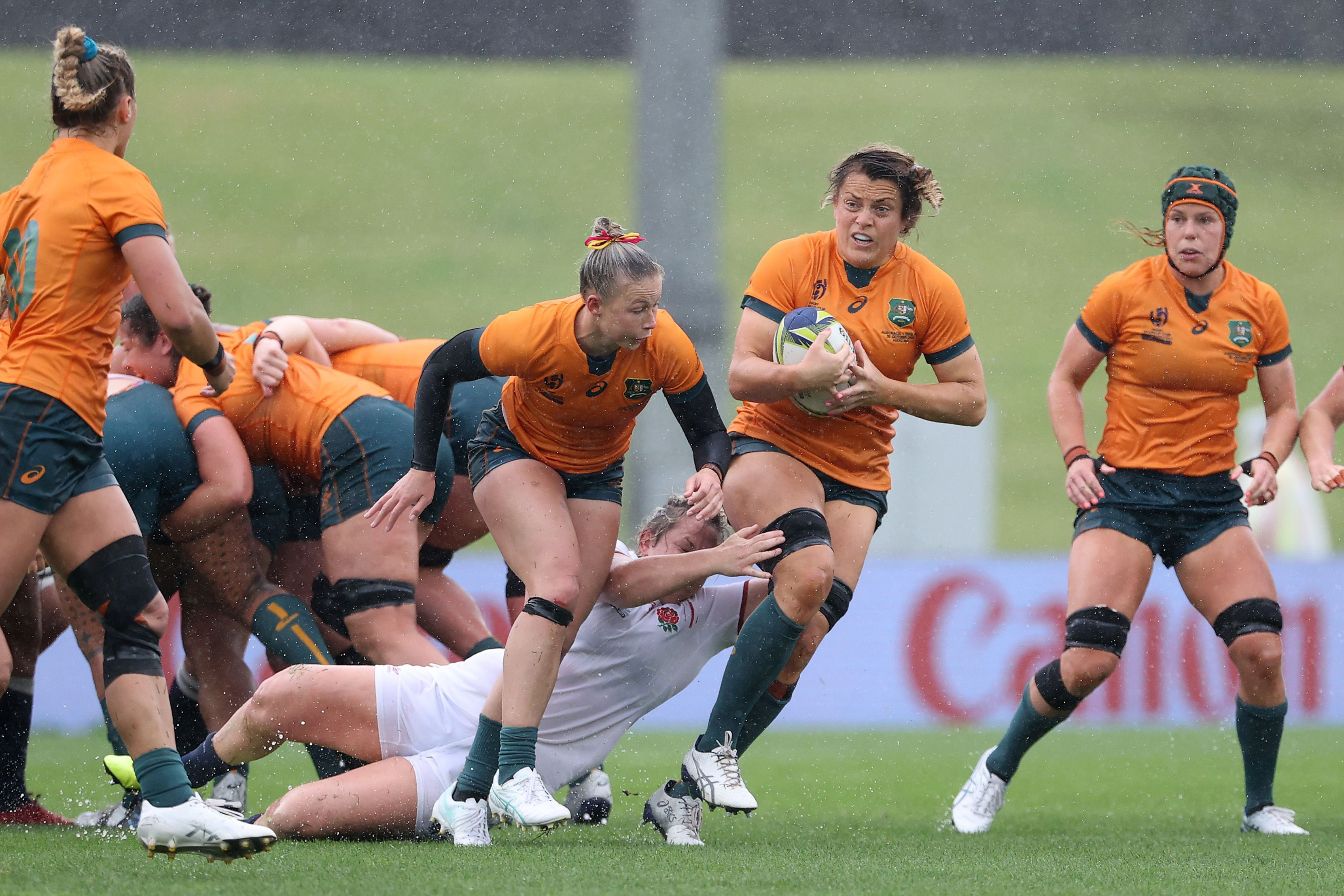 Grace Hamilton of Australia runs the ball in the quarter-final match with England.