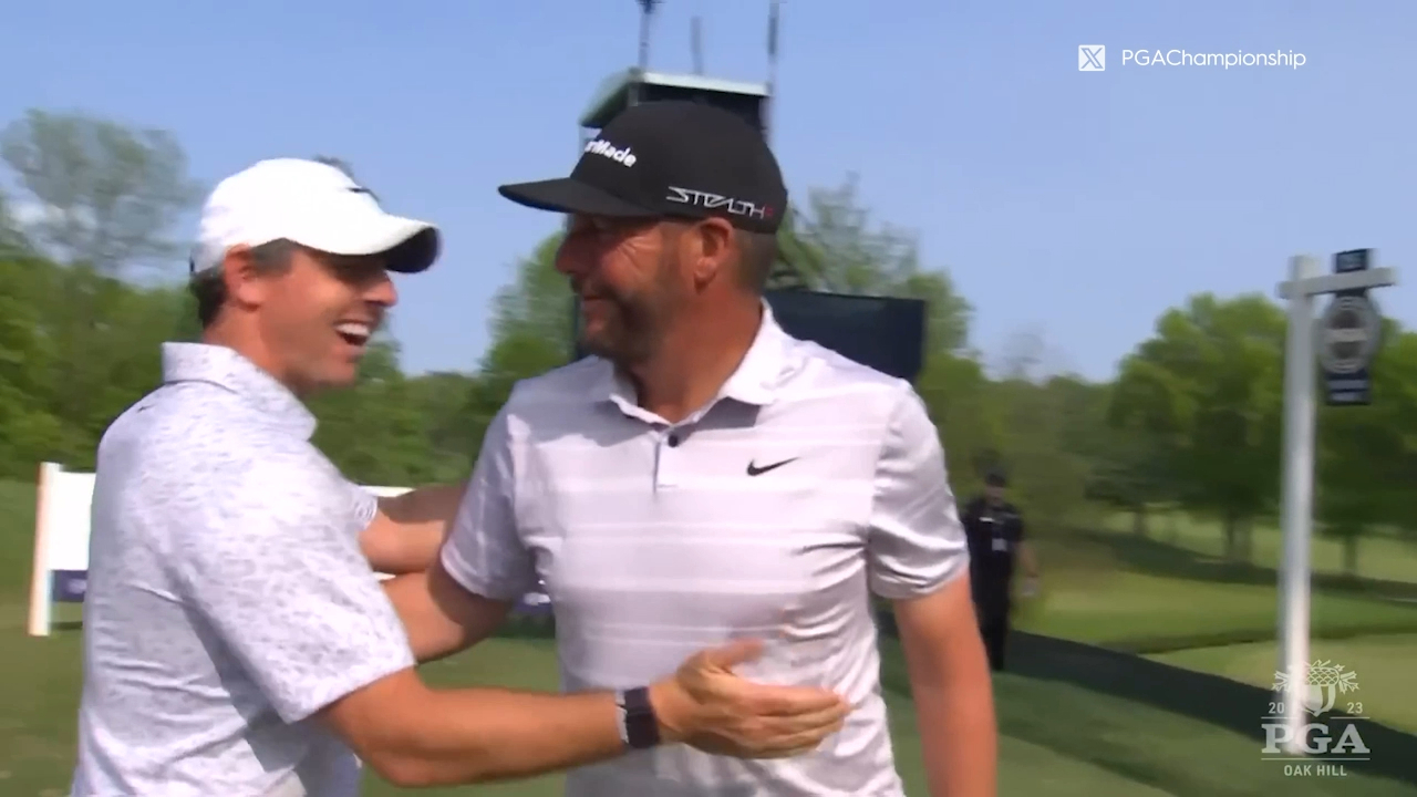 Rory McIlroy congratulates Michael Block on his PGA Championship hole in one.